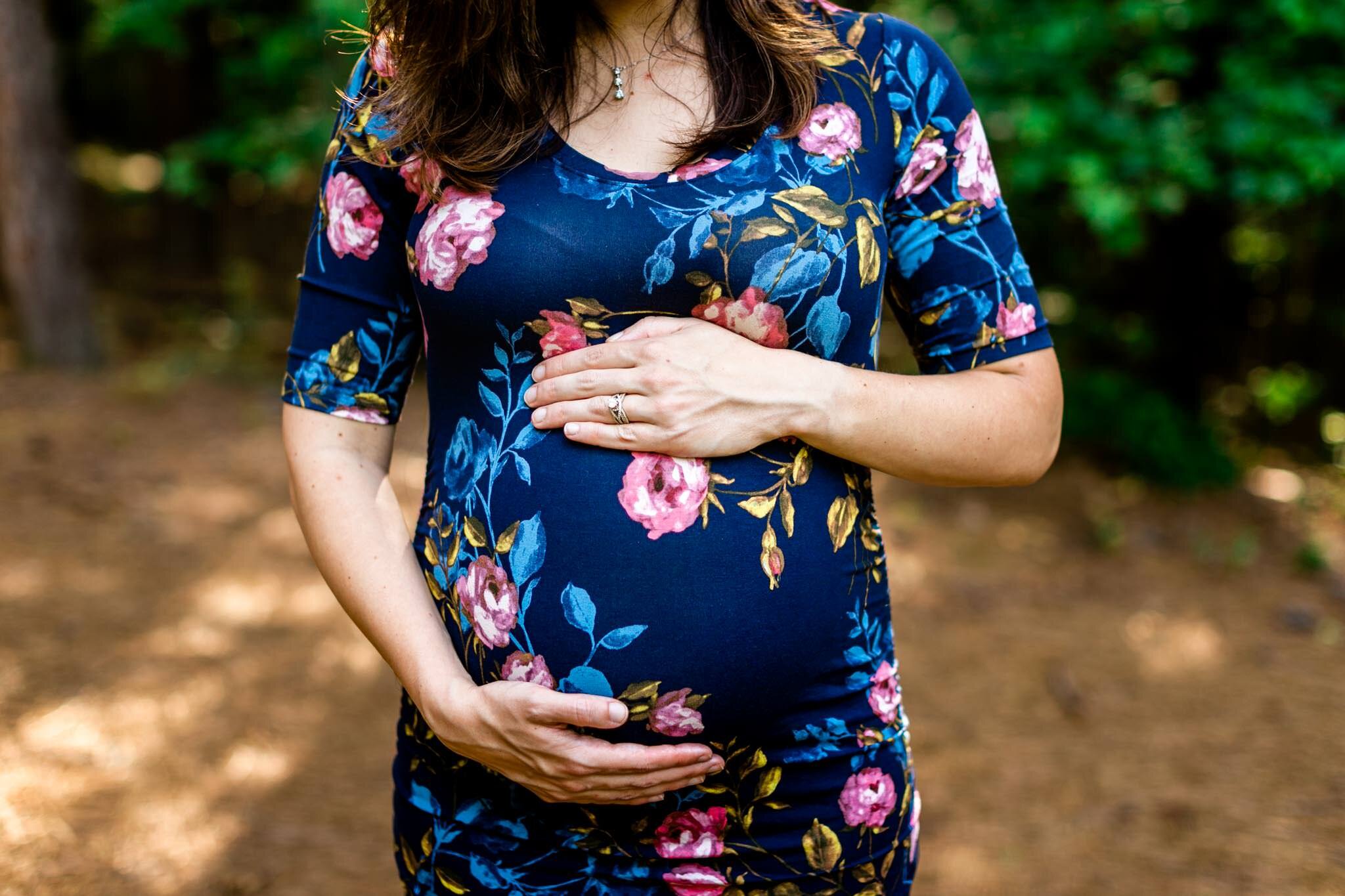 Raleigh Maternity Photographer | By G. Lin Photography | Umstead Park | Natural maternity portrait of woman with hands on baby bump