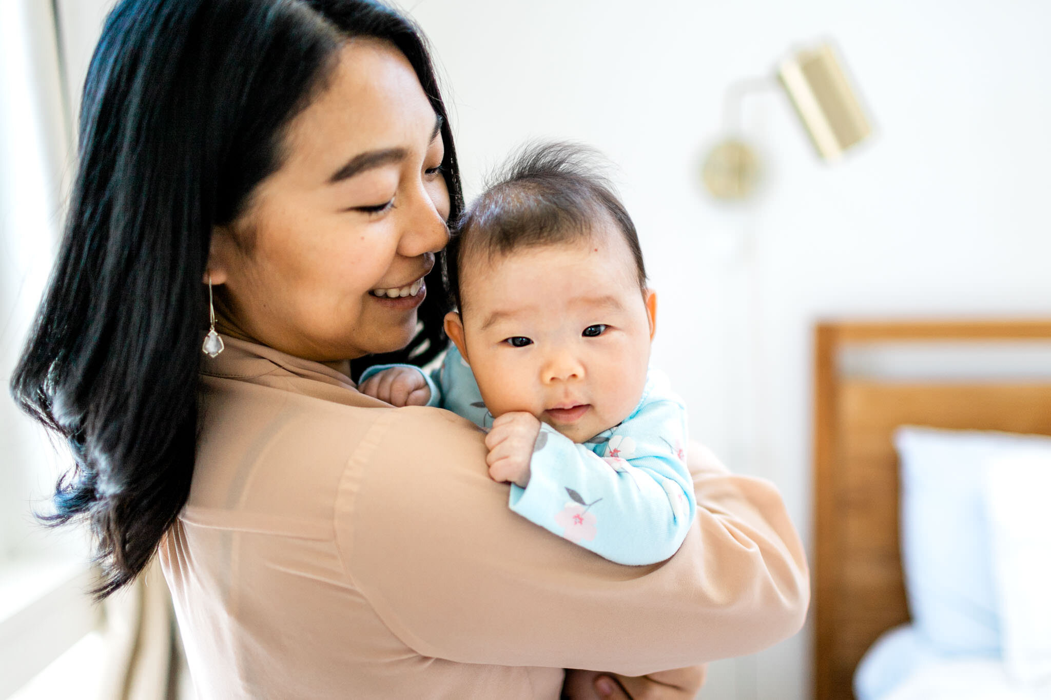 Raleigh Newborn Photographer | By G. Lin Photography | Organic photo of mom holding baby girl