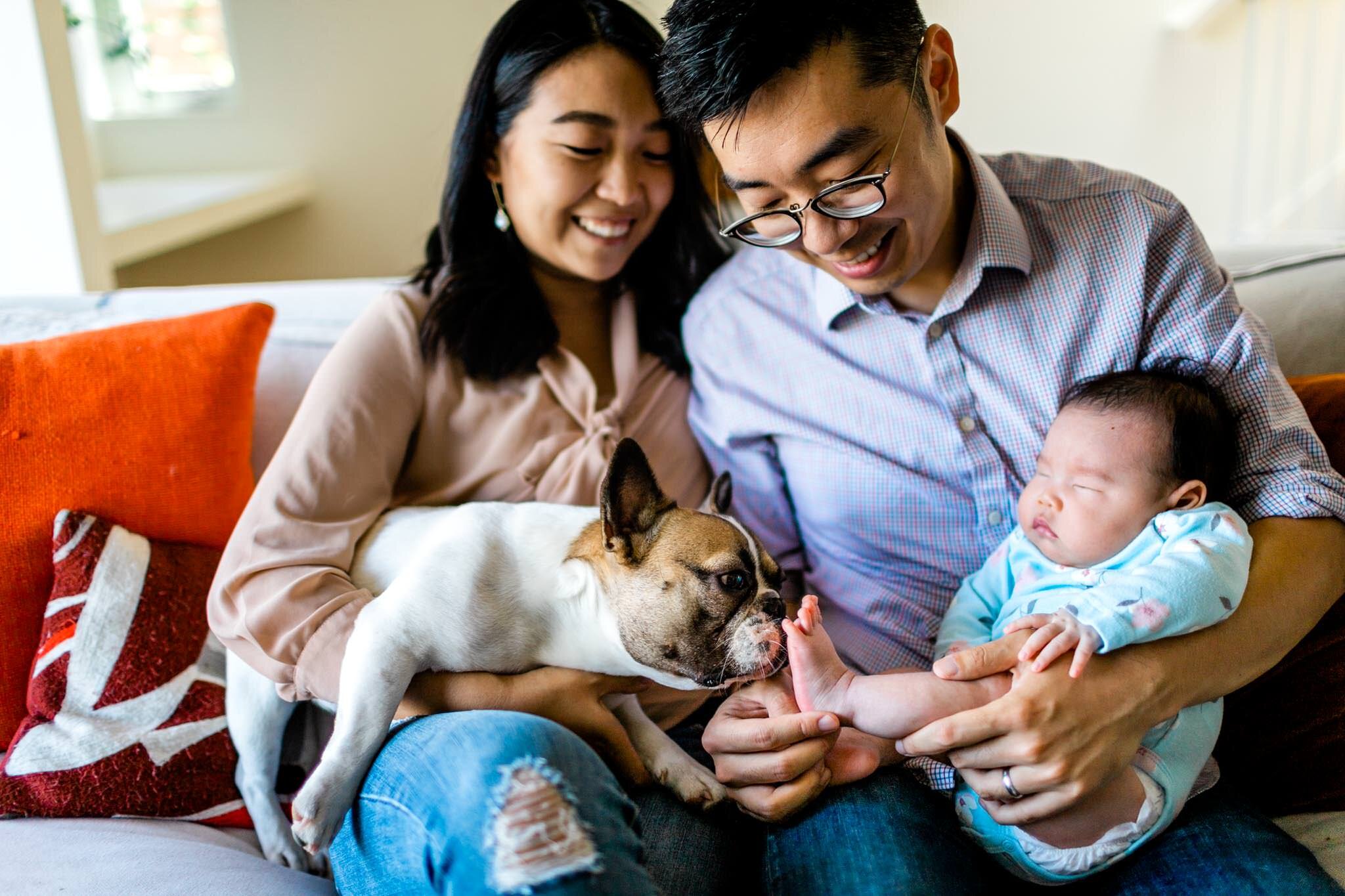 Raleigh Newborn Photographer | By G. Lin Photography | Dog licking baby's feet