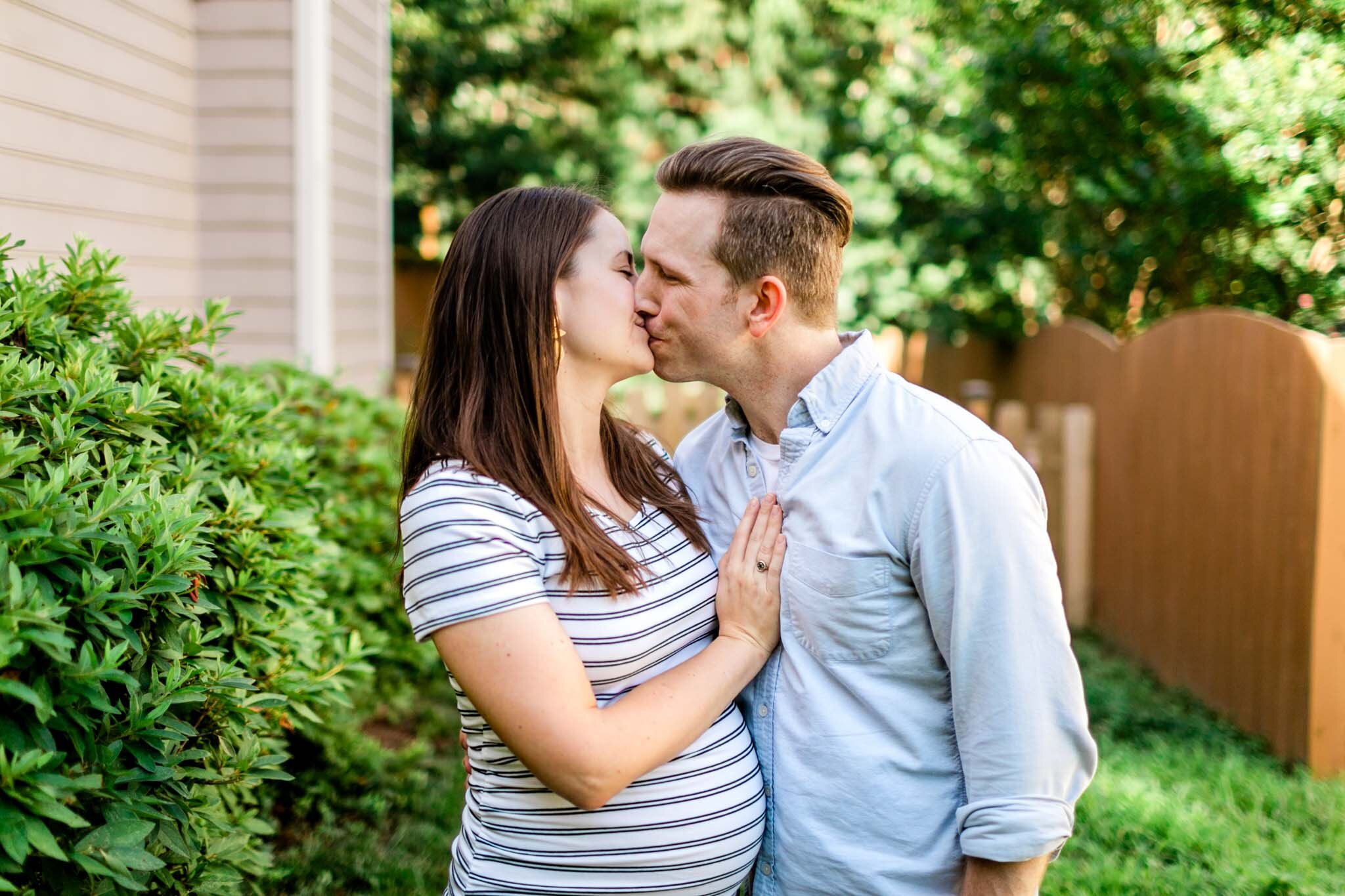 Durham Maternity Photographer | By G. Lin Photography | Candid couple photo of husband and wife kissing