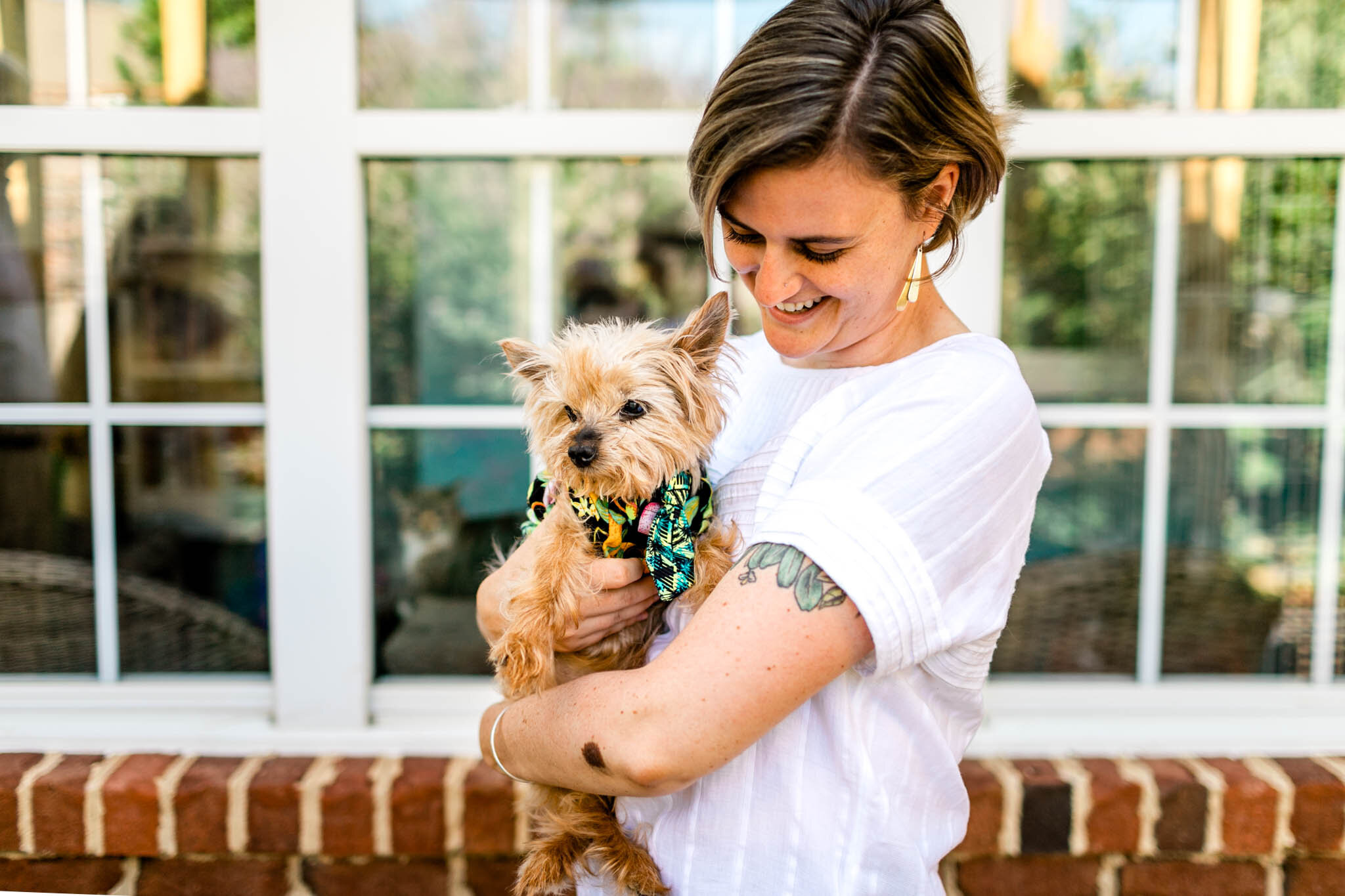 Raleigh Family Photographer | By G. Lin Photography | Woman holding yorkie outside