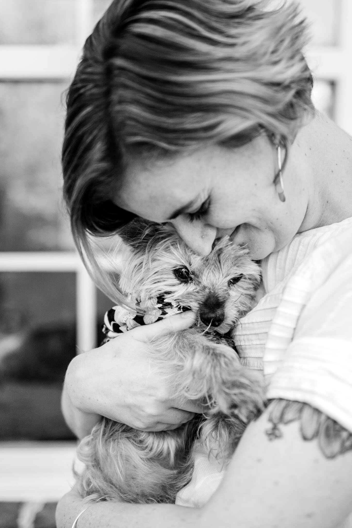 Raleigh Family Photographer | By G. Lin Photography | black and white photo of woman hugging yorkie