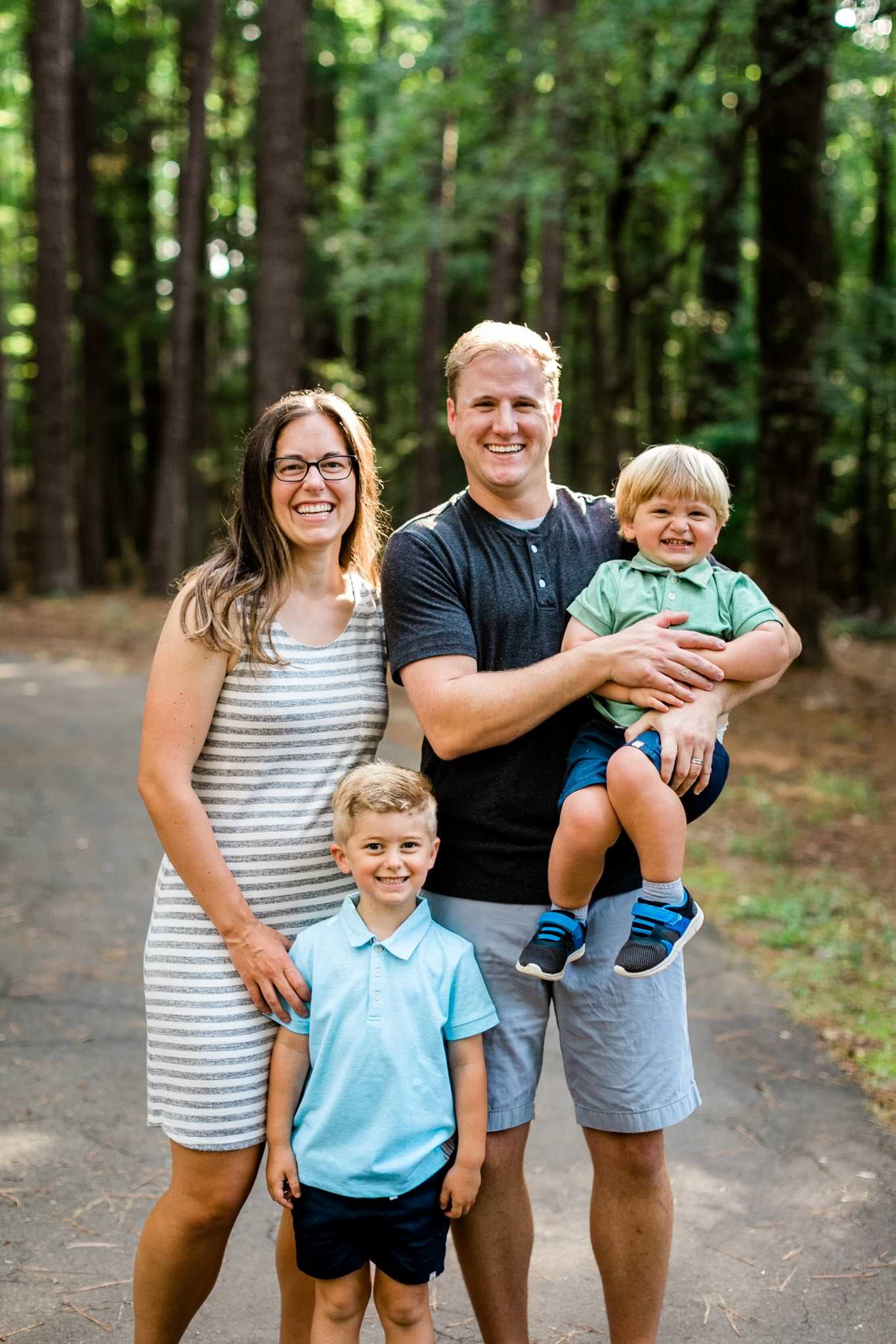 Raleigh Family Photographer | Umstead Park | By G. Lin Photography | Family smiling at camera outside