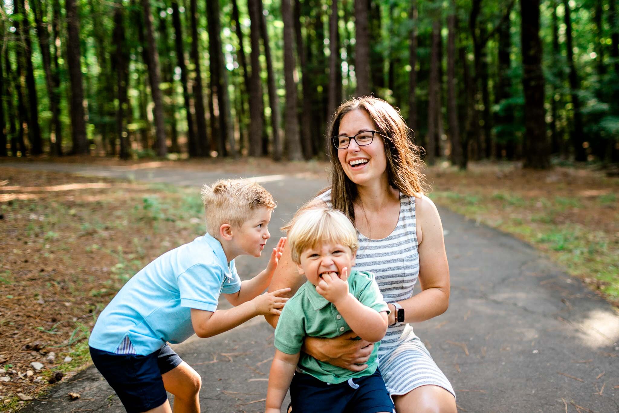 Raleigh Family Photographer | Umstead Park | By G. Lin Photography | Mom holding two sons outside