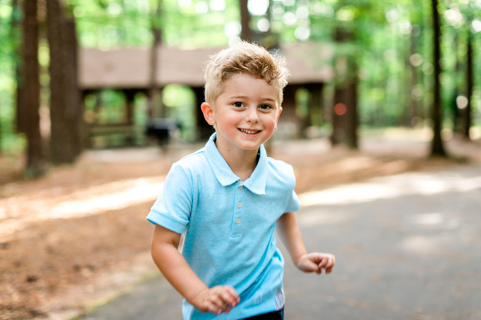 Raleigh Family Photographer | Umstead Park | By G. Lin Photography | Young boy running outside