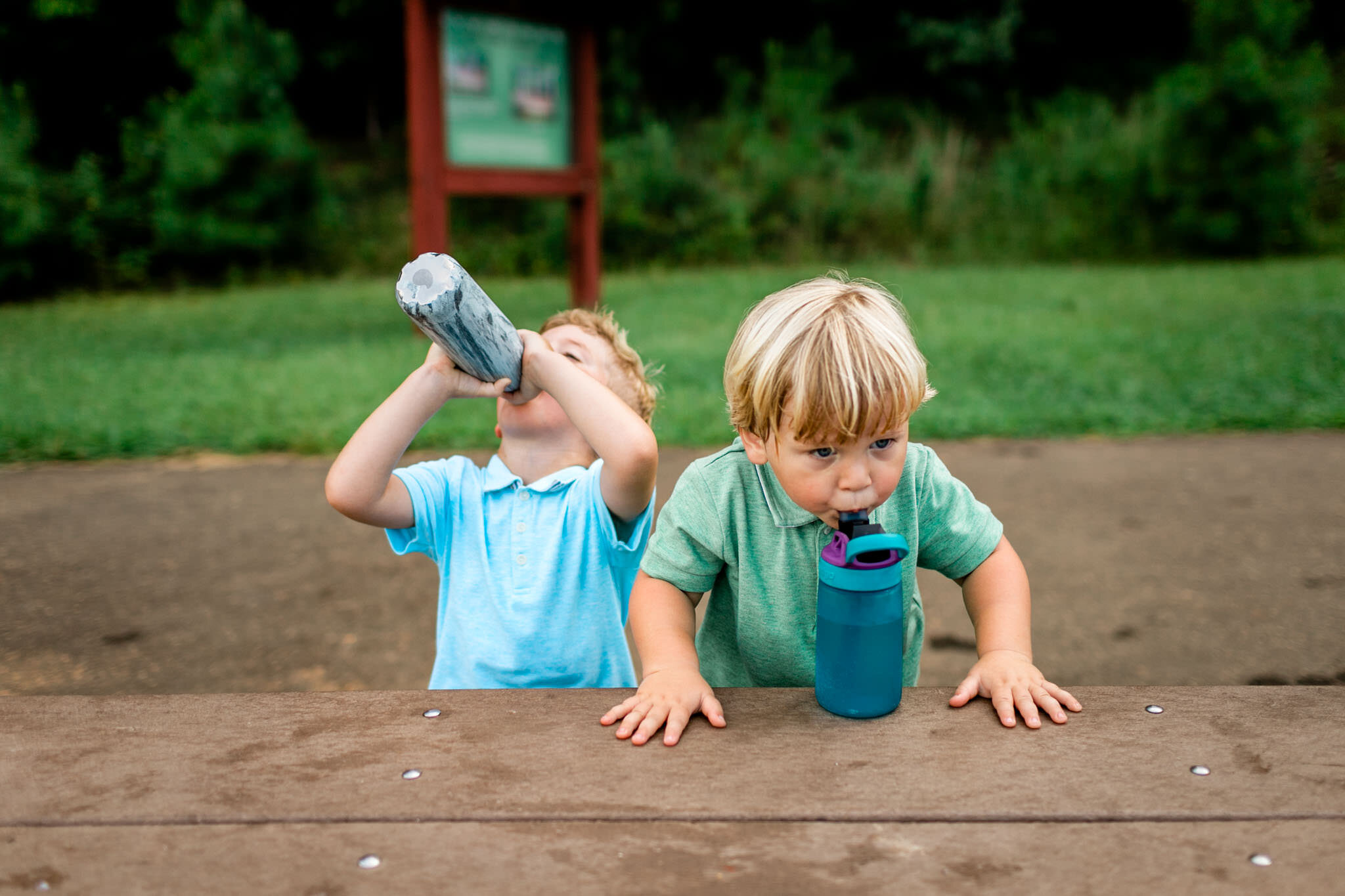 Raleigh Family Photographer | Umstead Park | By G. Lin Photography | Boy drinking from water bottle