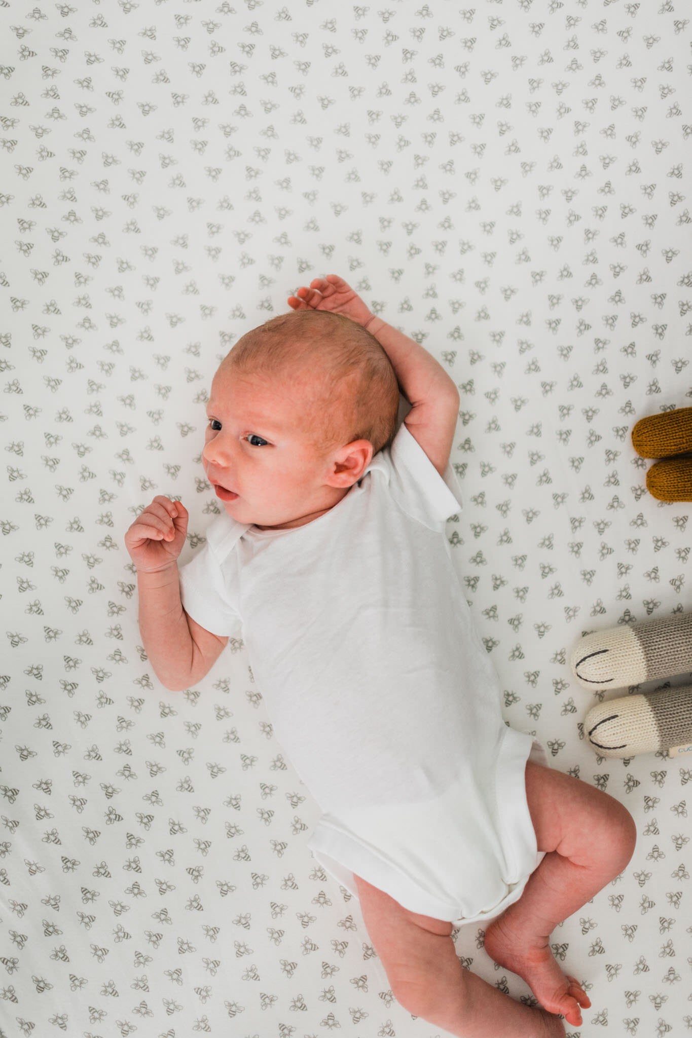 Raleigh Newborn Photographer | By G. Lin Photography | Baby boy laying on his back inside crib