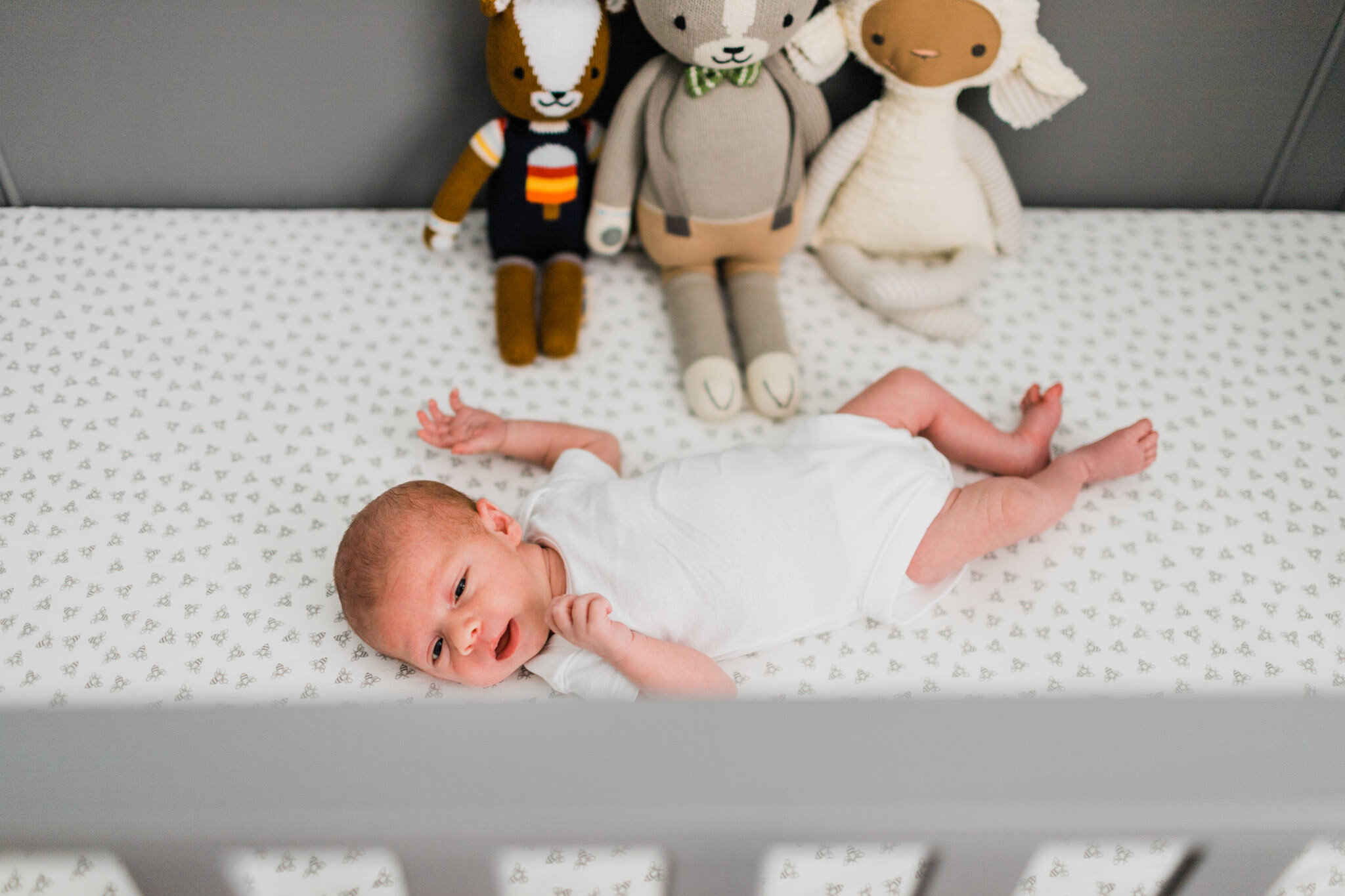 Raleigh Newborn Photographer | By G. Lin Photography | Baby boy laying inside crib