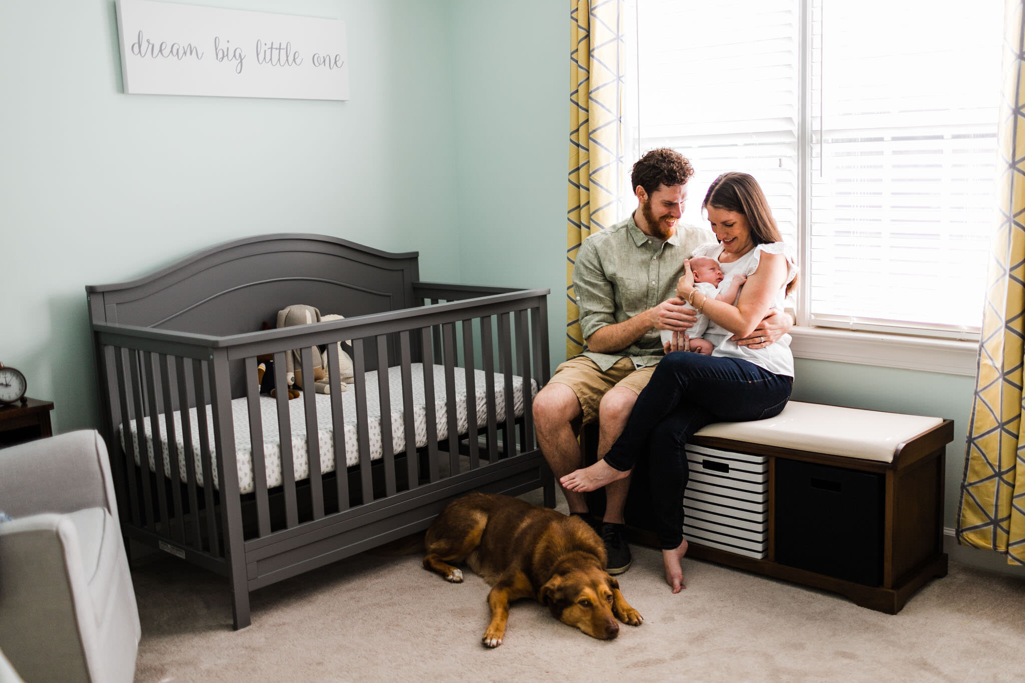 Raleigh Newborn Photographer | By G. Lin Photography | Parents holding baby in nursery by window light