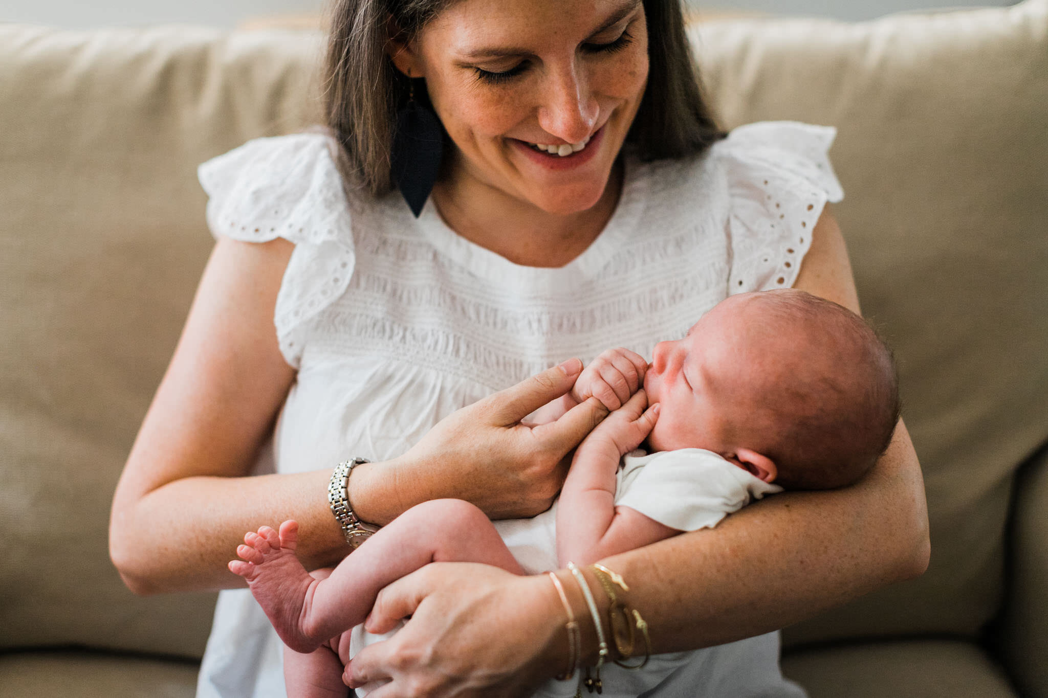 Raleigh Newborn Photographer | By G. Lin Photography | Mother holding baby in her arms inside home | Lifestyle newborn photo at home