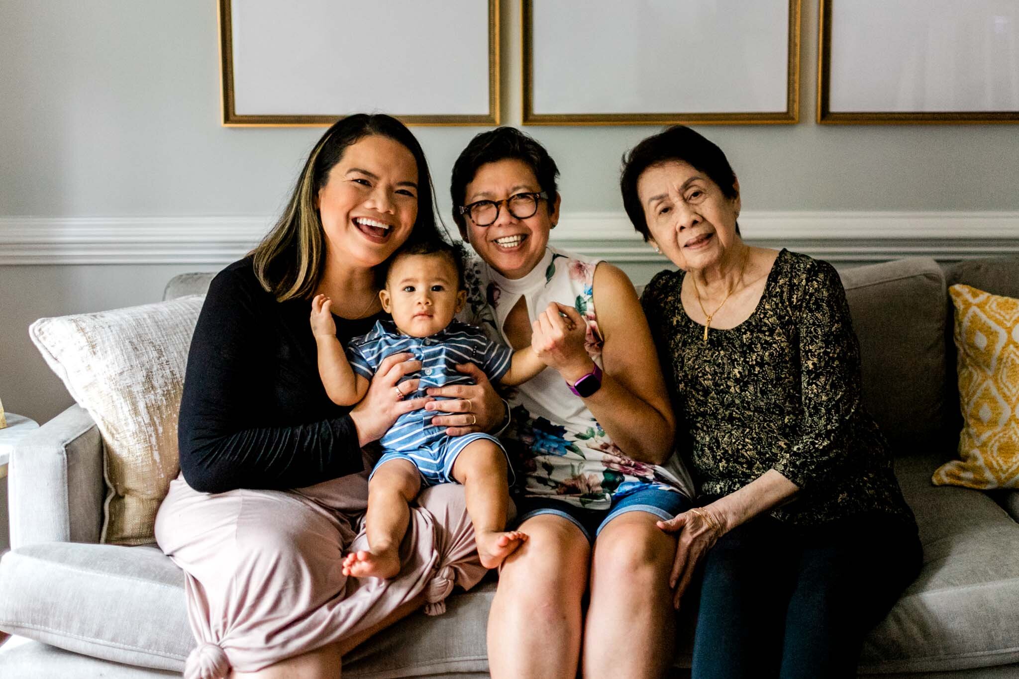 Raleigh Family Photographer | By G. Lin Photography | Lifestyle family photo of women with baby sitting on couch
