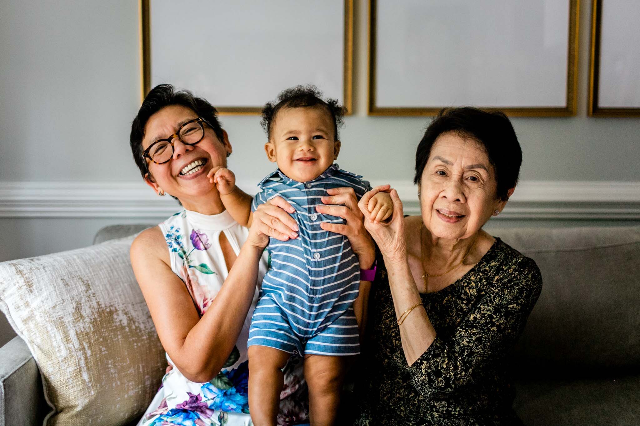 Raleigh Family Photographer | By G. Lin Photography | Baby boy smiling and being held by two women