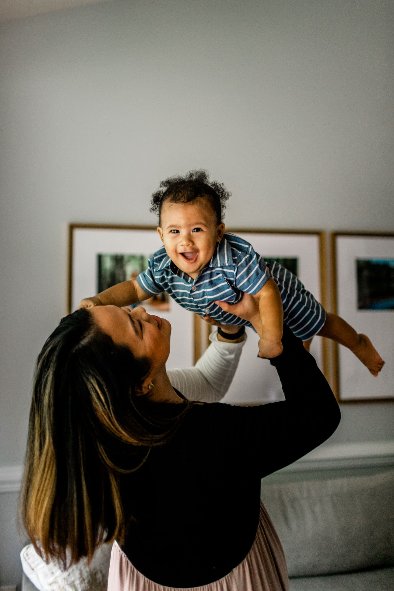 Raleigh Family Photographer | By G. Lin Photography | Mother holding baby boy in the air