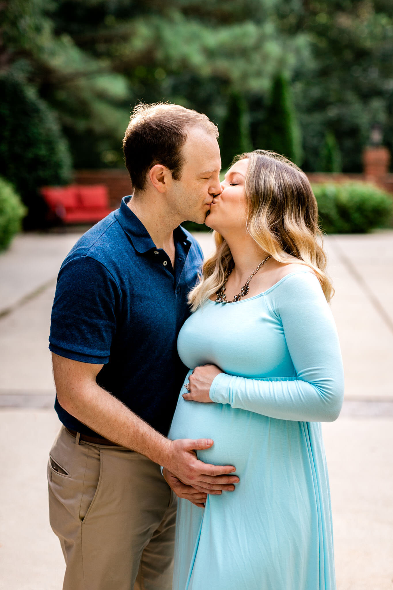 Raleigh Maternity Photographer | By G. Lin Photography | Couple kissing while touching baby bump