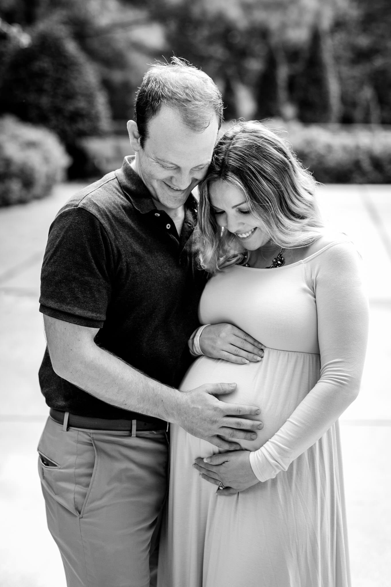 Raleigh Maternity Photographer | By G. Lin Photography | Black and white photo of couple touching baby bump