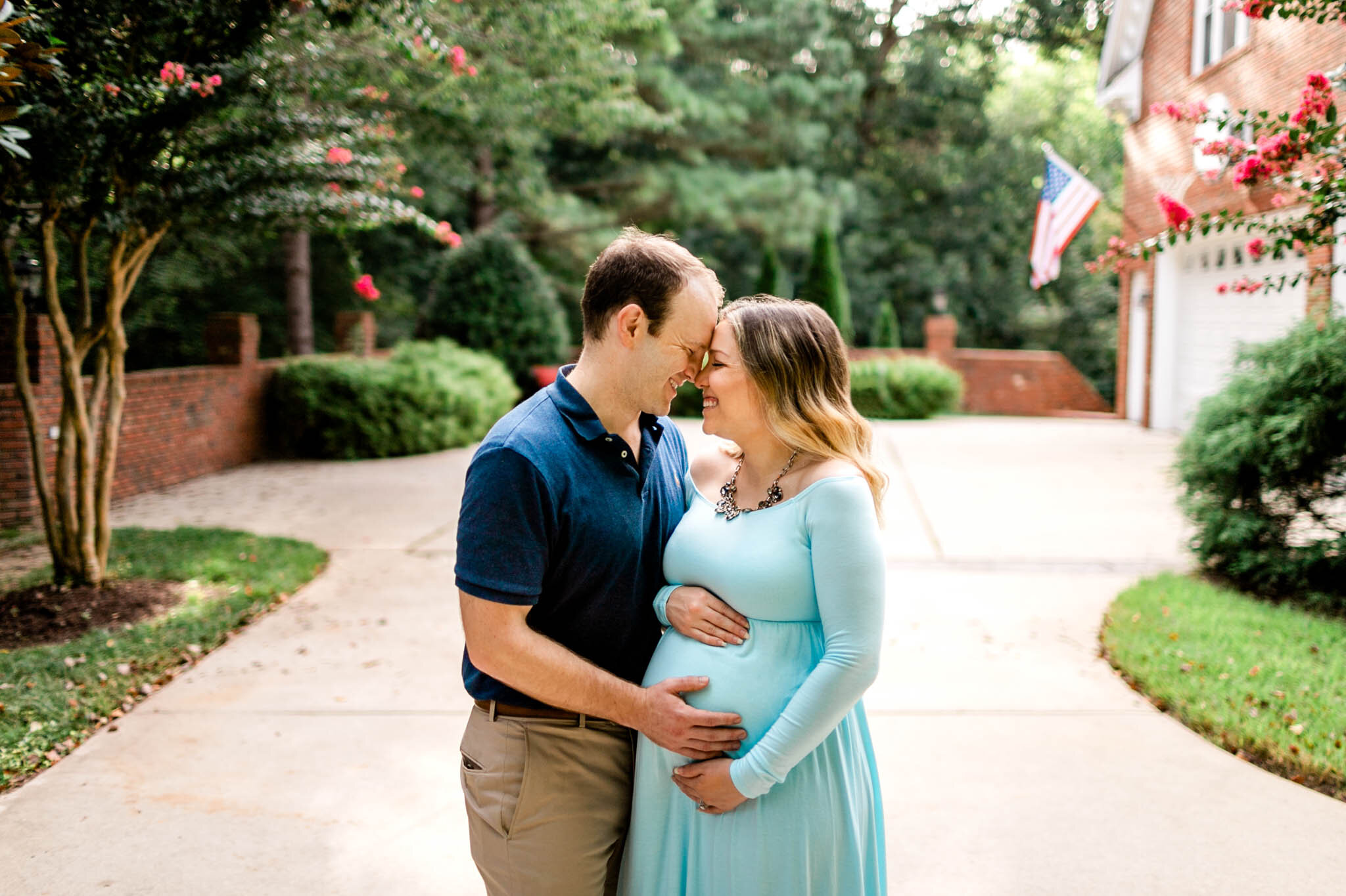 Raleigh Maternity Photographer | By G. Lin Photography | Man and woman smiling and holding baby bump