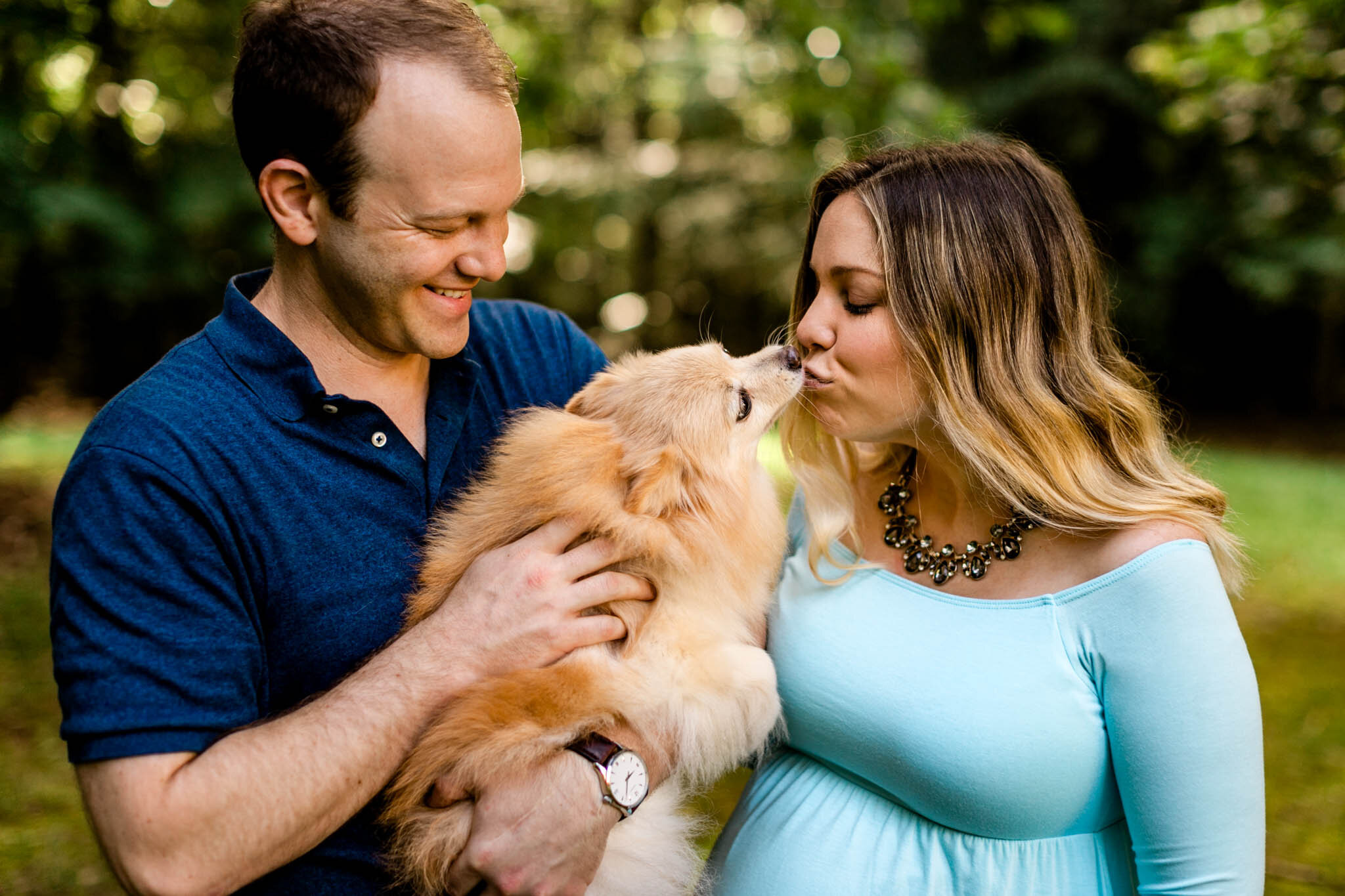 Raleigh Maternity Photographer | By G. Lin Photography | Woman giving a kiss to her dog
