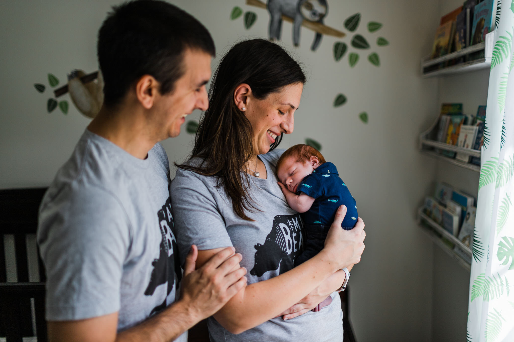 Raleigh Newborn Photographer | By G. Lin Photography | Parents carrying baby by window