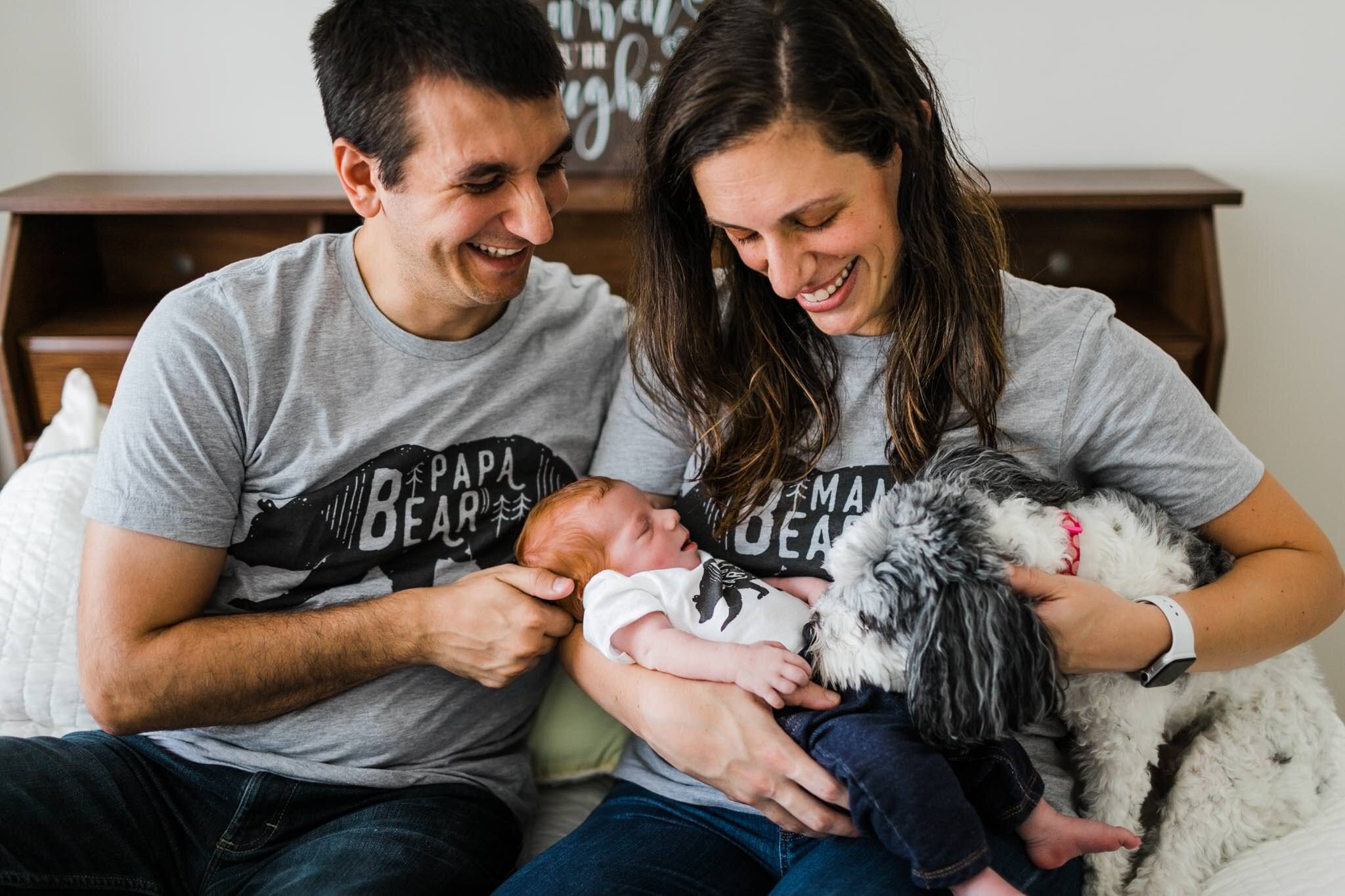 Raleigh Newborn Photographer | By G. Lin Photography | Candid newborn photo of family sitting on bed and laughing | Lifestyle newborn photography