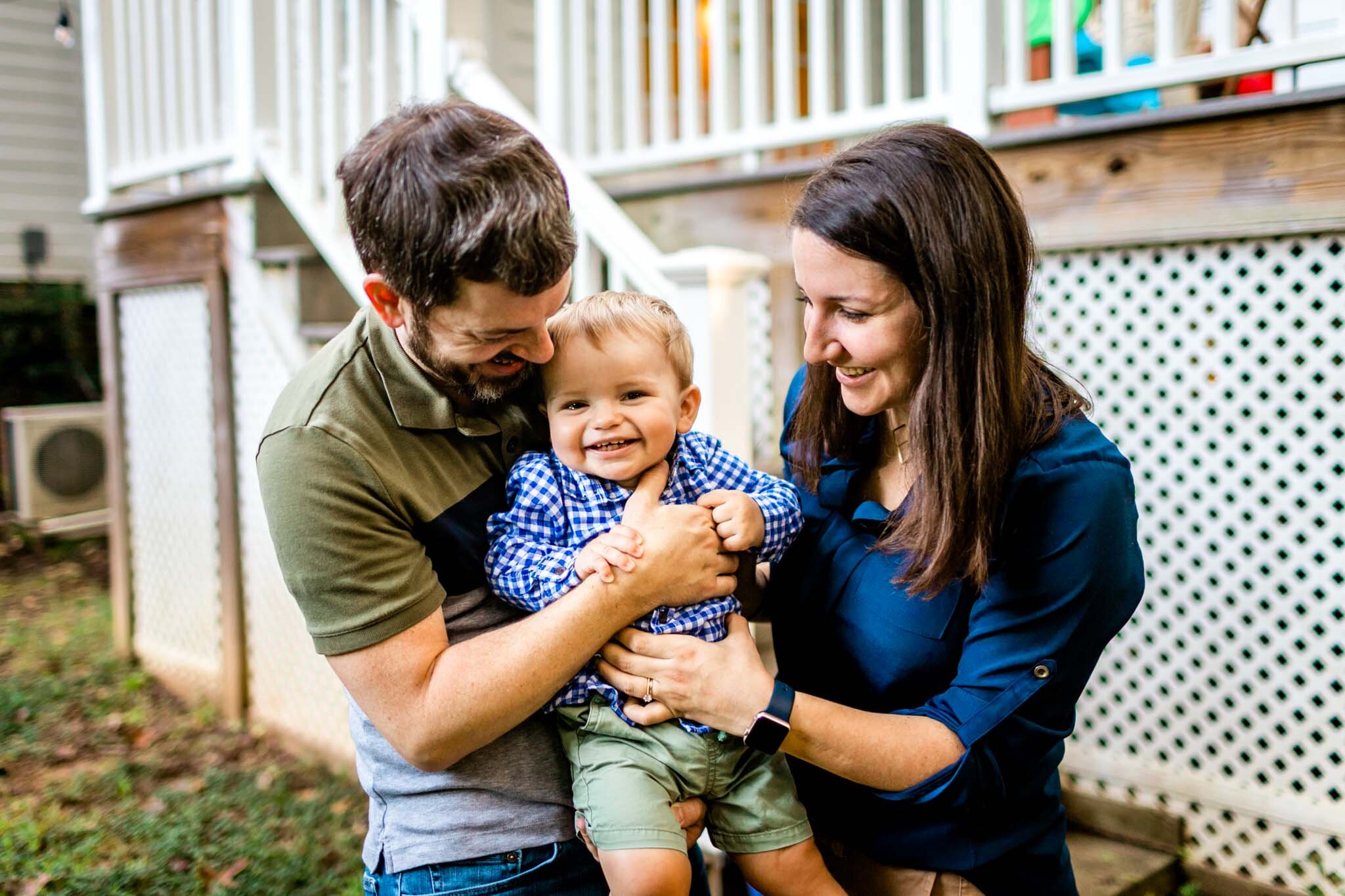 Raleigh Family Photographer | By G. Lin Photography | Mother and father holding baby boy