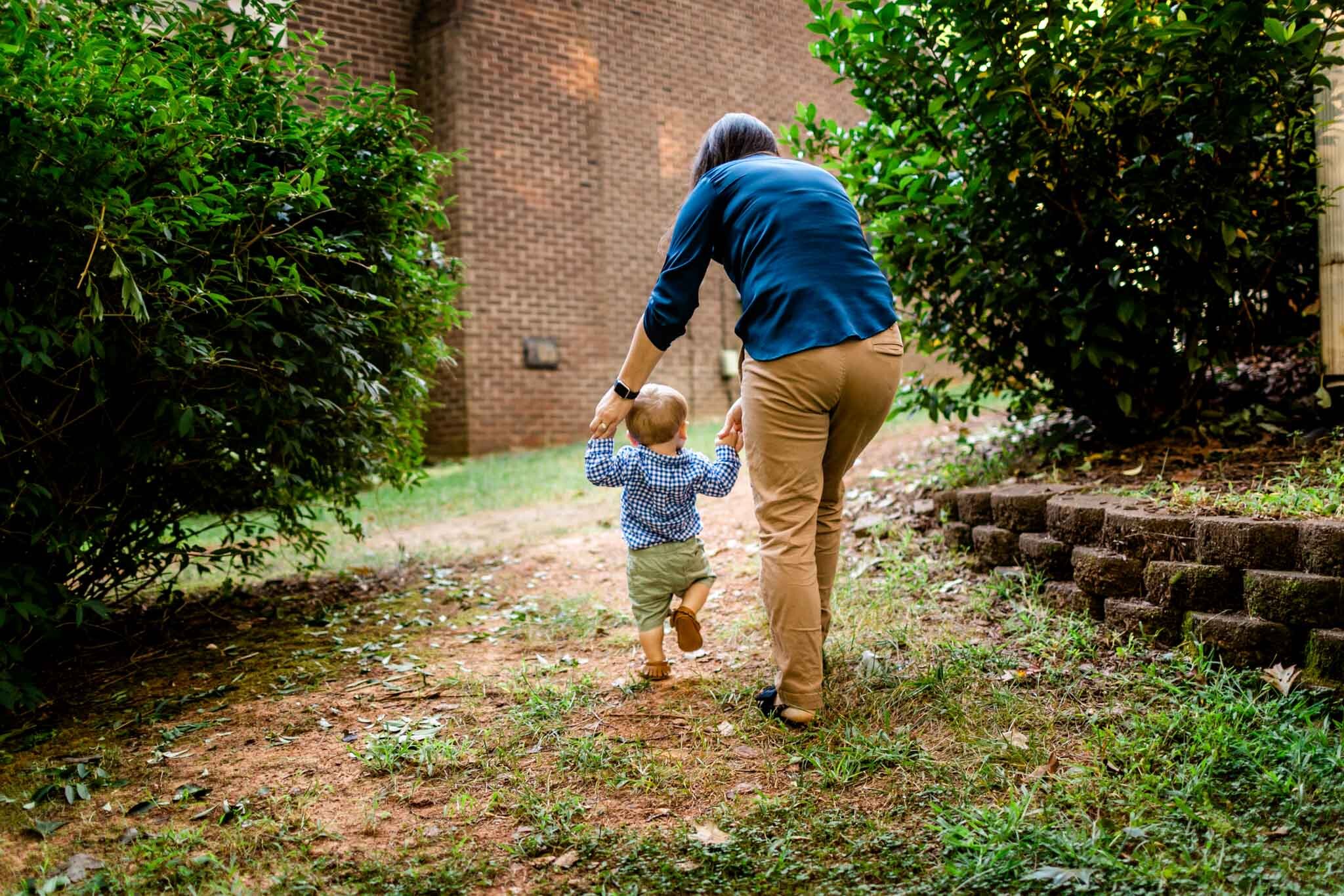 Raleigh Family Photographer | By G. Lin Photography | Mother holding baby's hands while walking