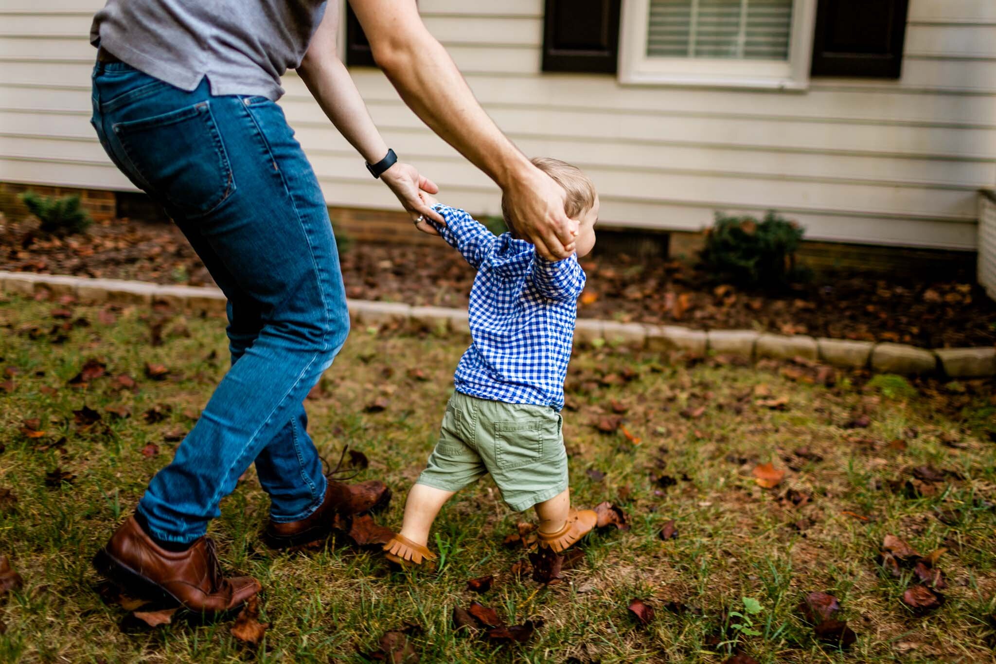 Raleigh Family Photographer | By G. Lin Photography | Little baby boy walking while holding father's hands
