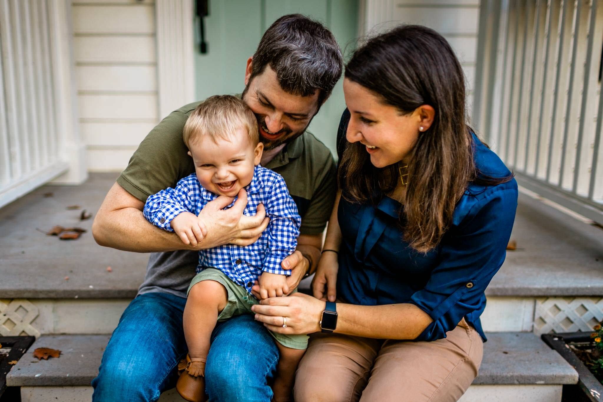 Raleigh Family Photographer | By G. Lin Photography | Family sitting on porch and tickling baby