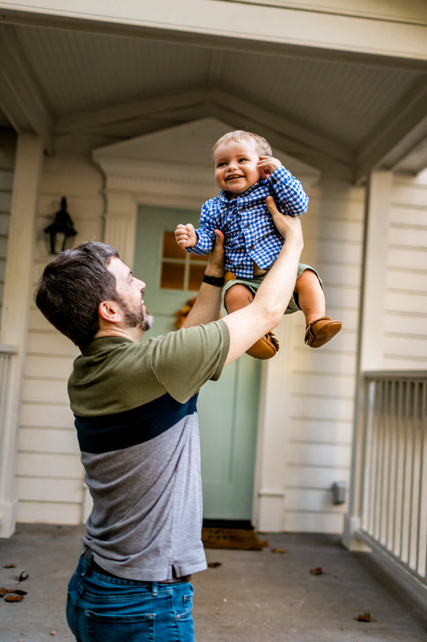 Raleigh Family Photographer | By G. Lin Photography | Dad tossing baby boy in the air