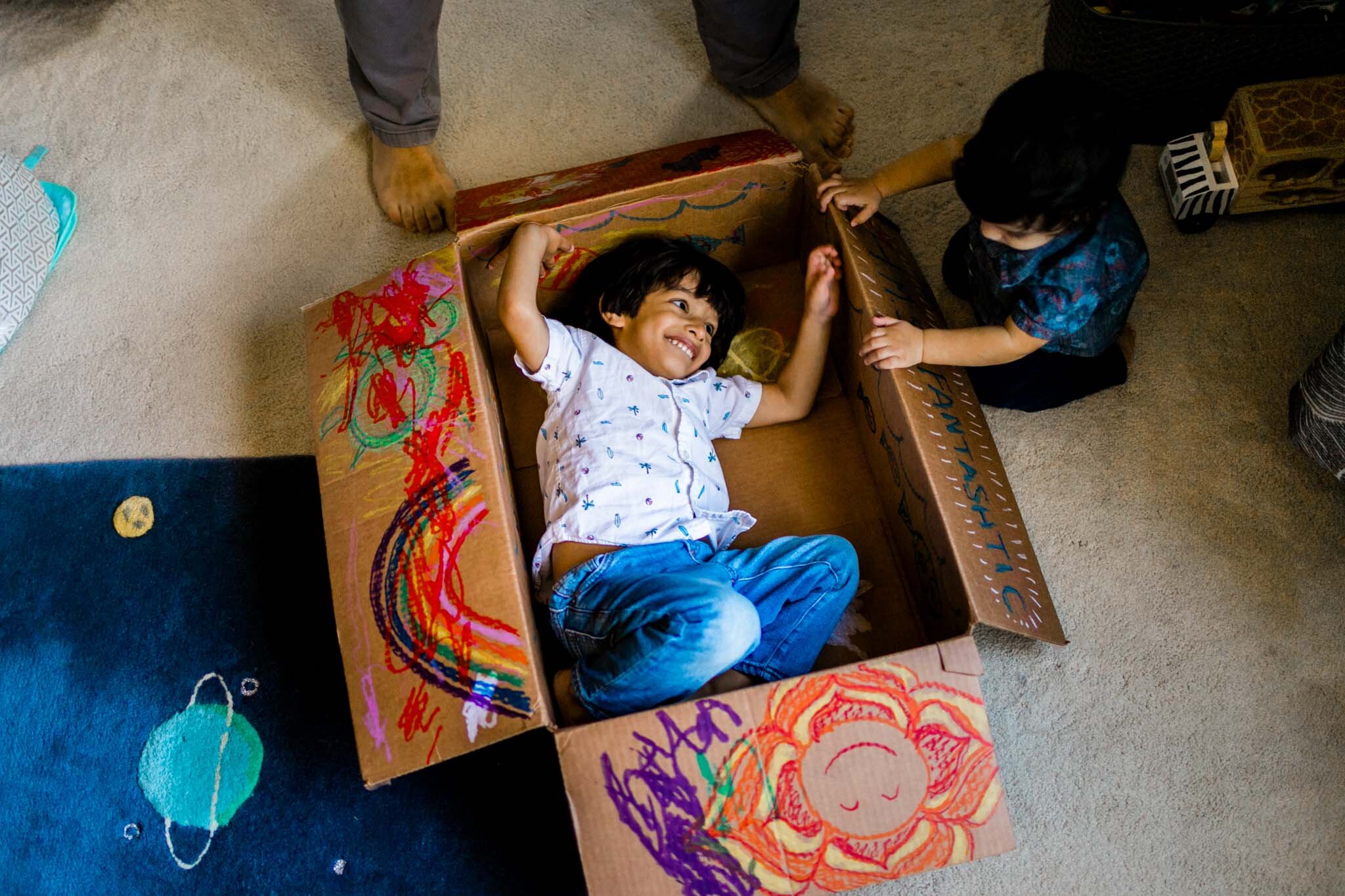 Durham Family Photographer | By G. Lin Photography | Boy playing inside of box