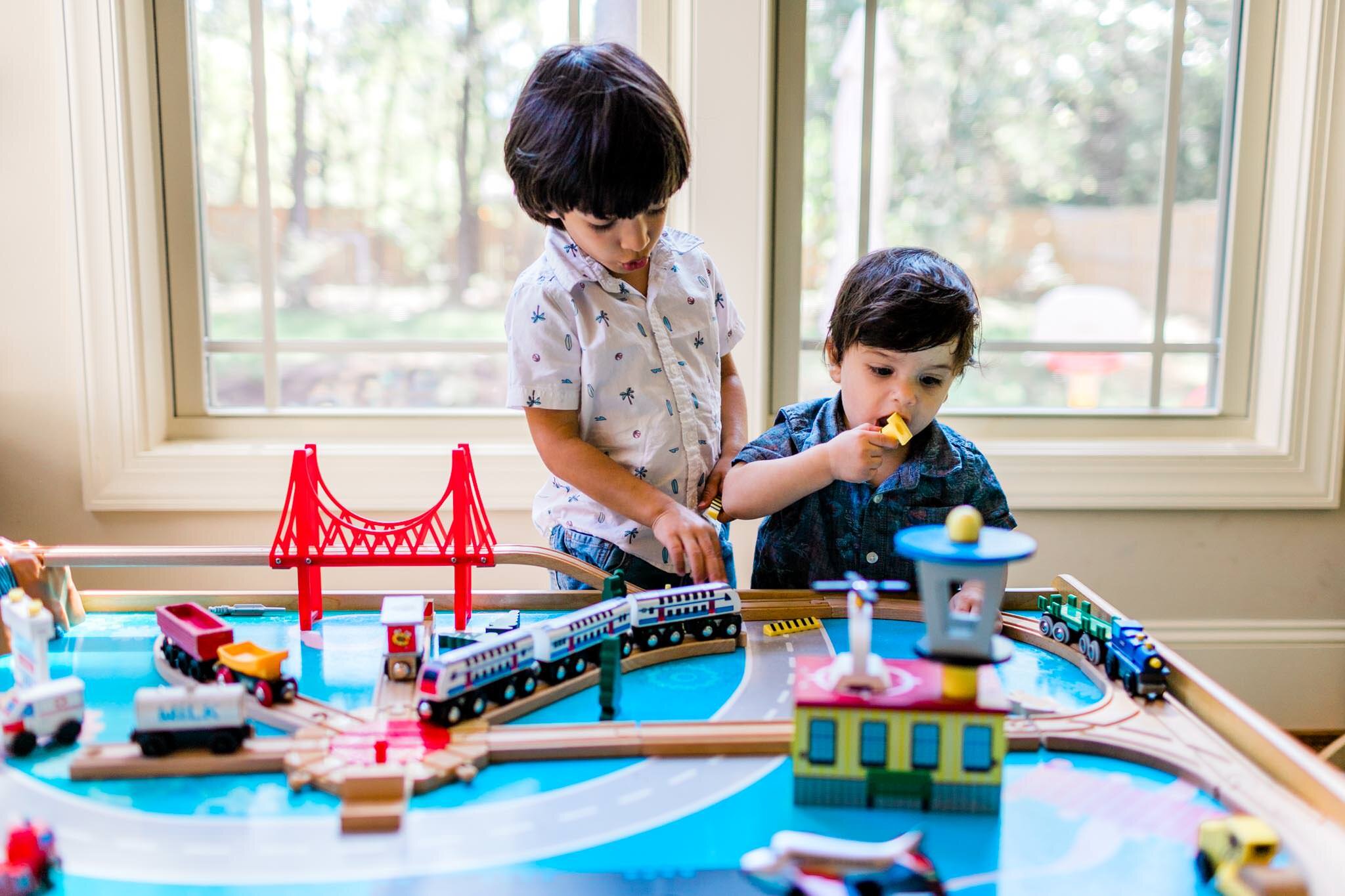Durham Family Photographer | By G. Lin Photography | Young brothers playing with train set