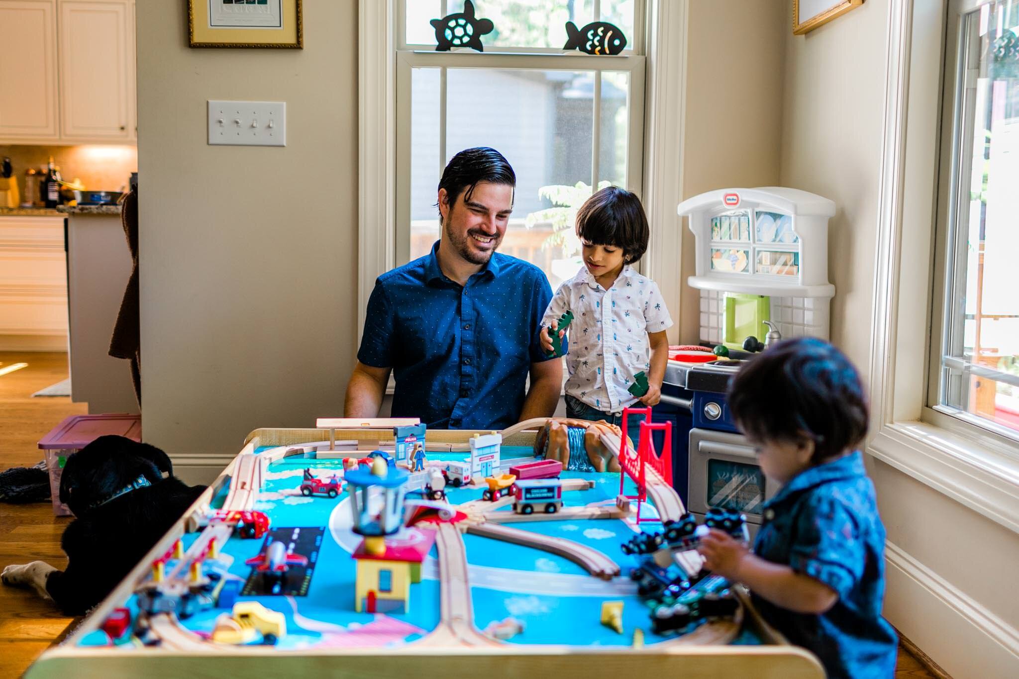Durham Family Photographer | By G. Lin Photography | Boy playing trains with dad