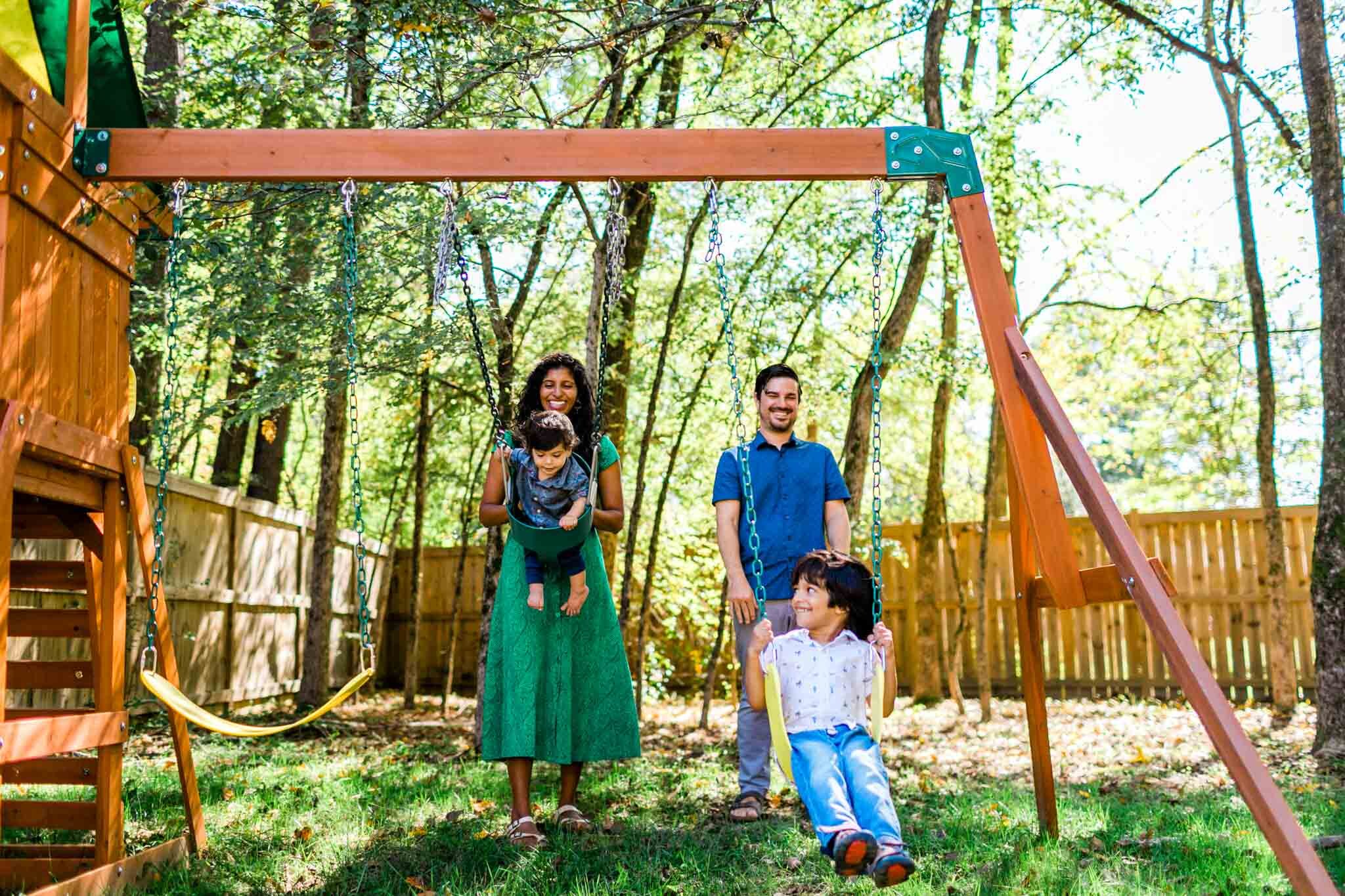 Durham Family Photographer | By G. Lin Photography | Parents pushing kids on swings