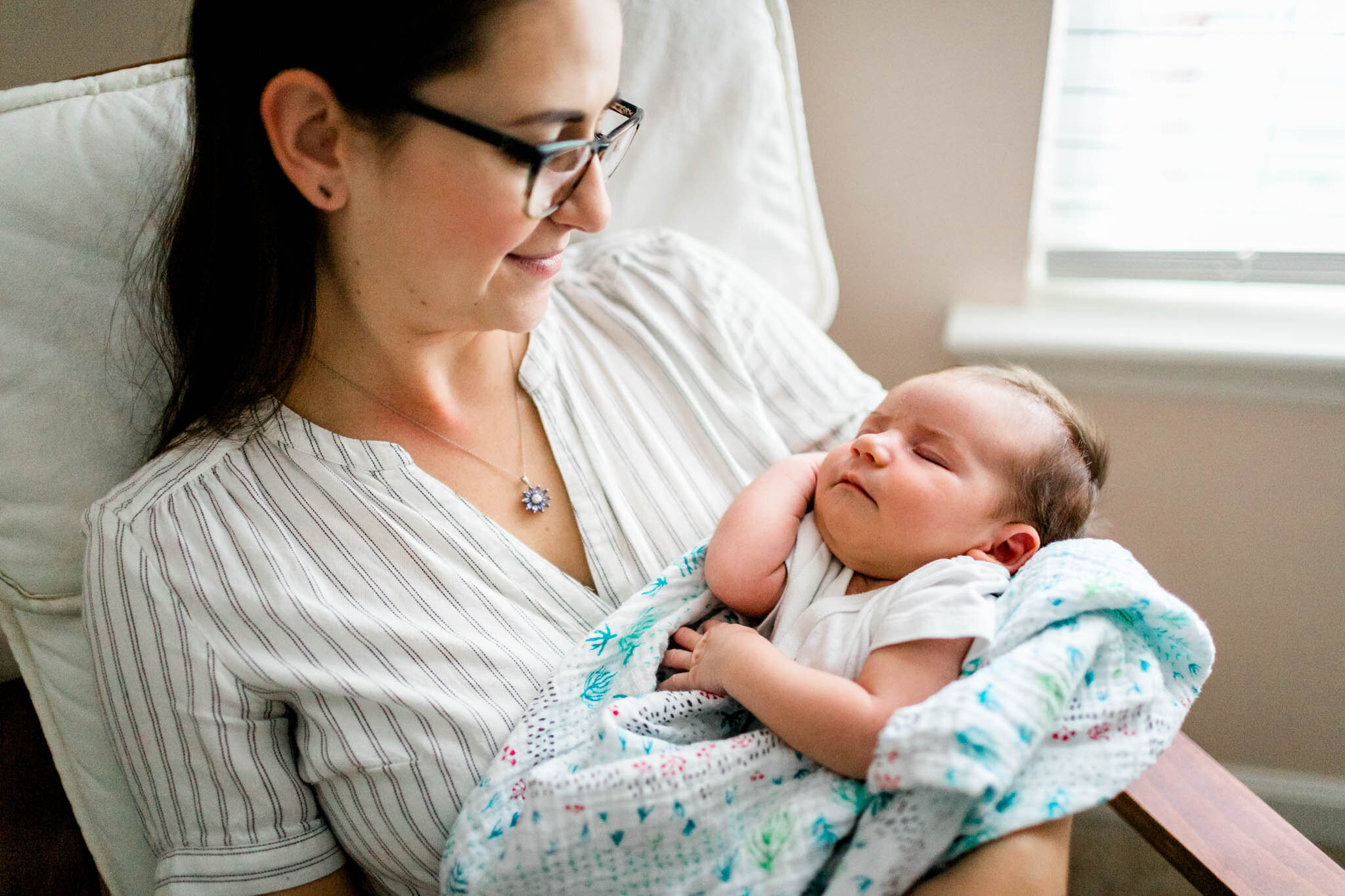 Raleigh Newborn Photographer | By G. Lin Photography | Mother holding baby girl in nursery