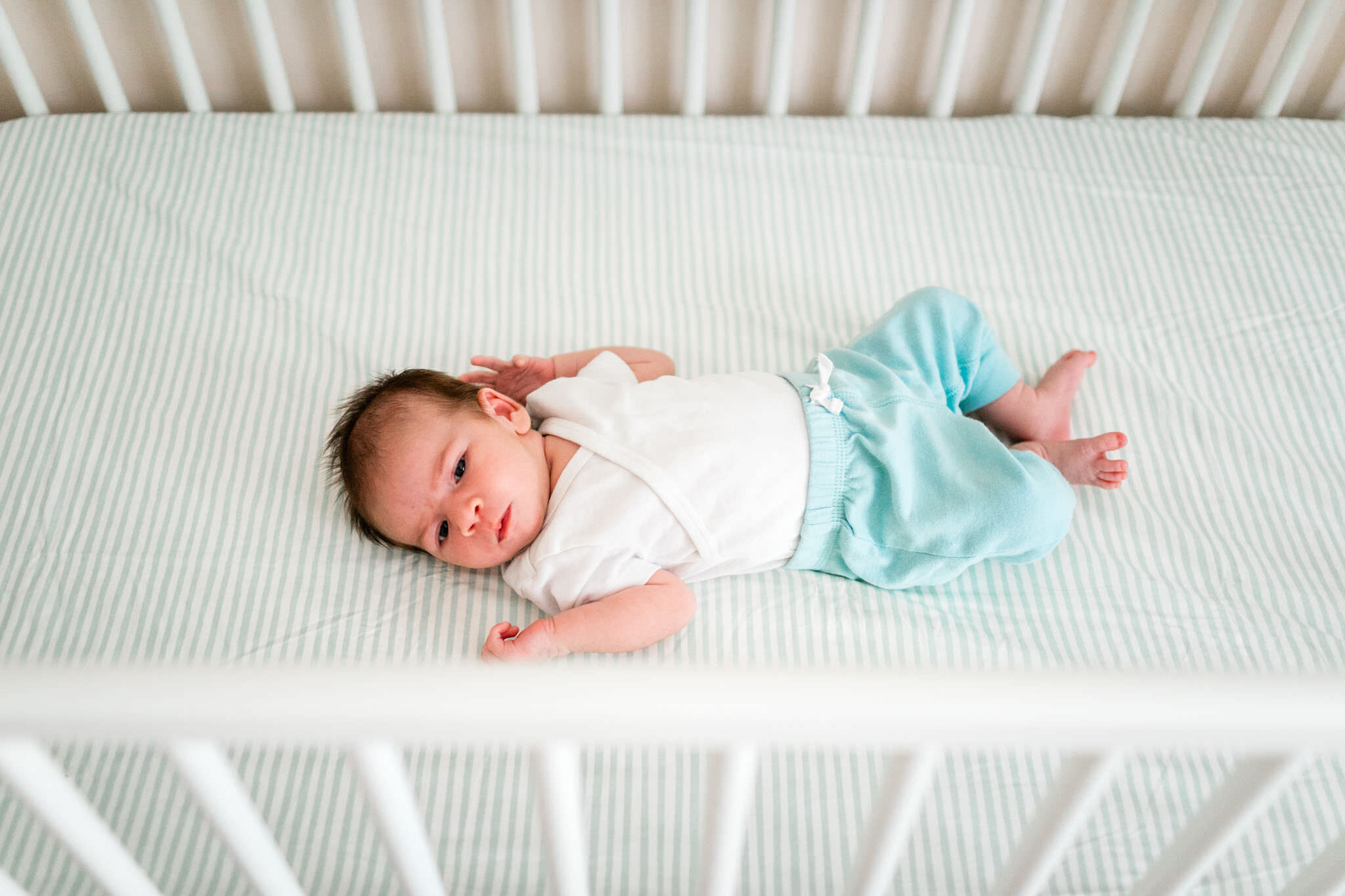 Raleigh Newborn Photographer | By G. Lin Photography | Baby laying in crib