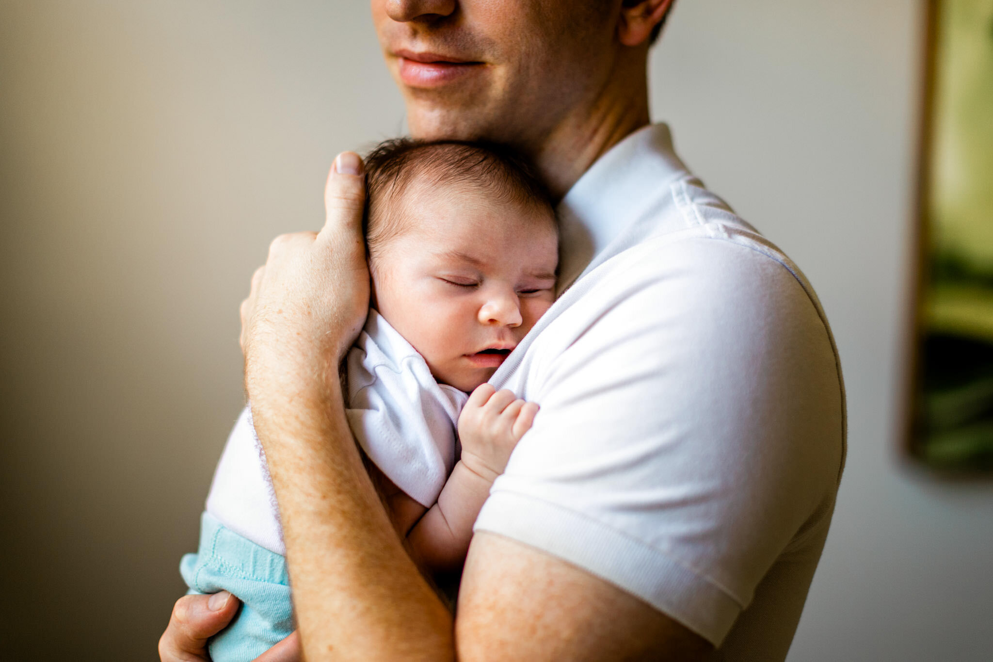 Raleigh Newborn Photographer | By G. Lin Photography | Father holding baby in arms