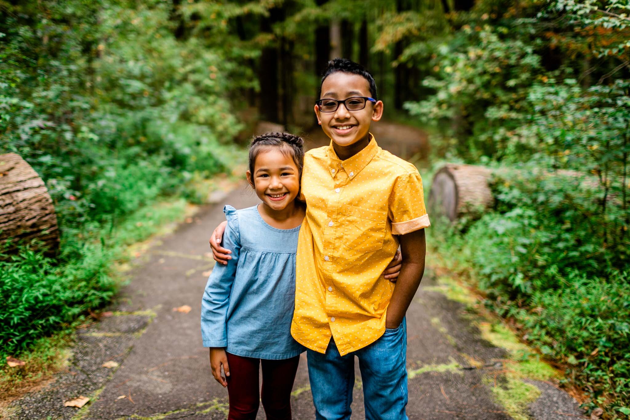 Raleigh Family Photographer | By G. Lin Photography | Umstead Park | Candid portrait of young brother and sister
