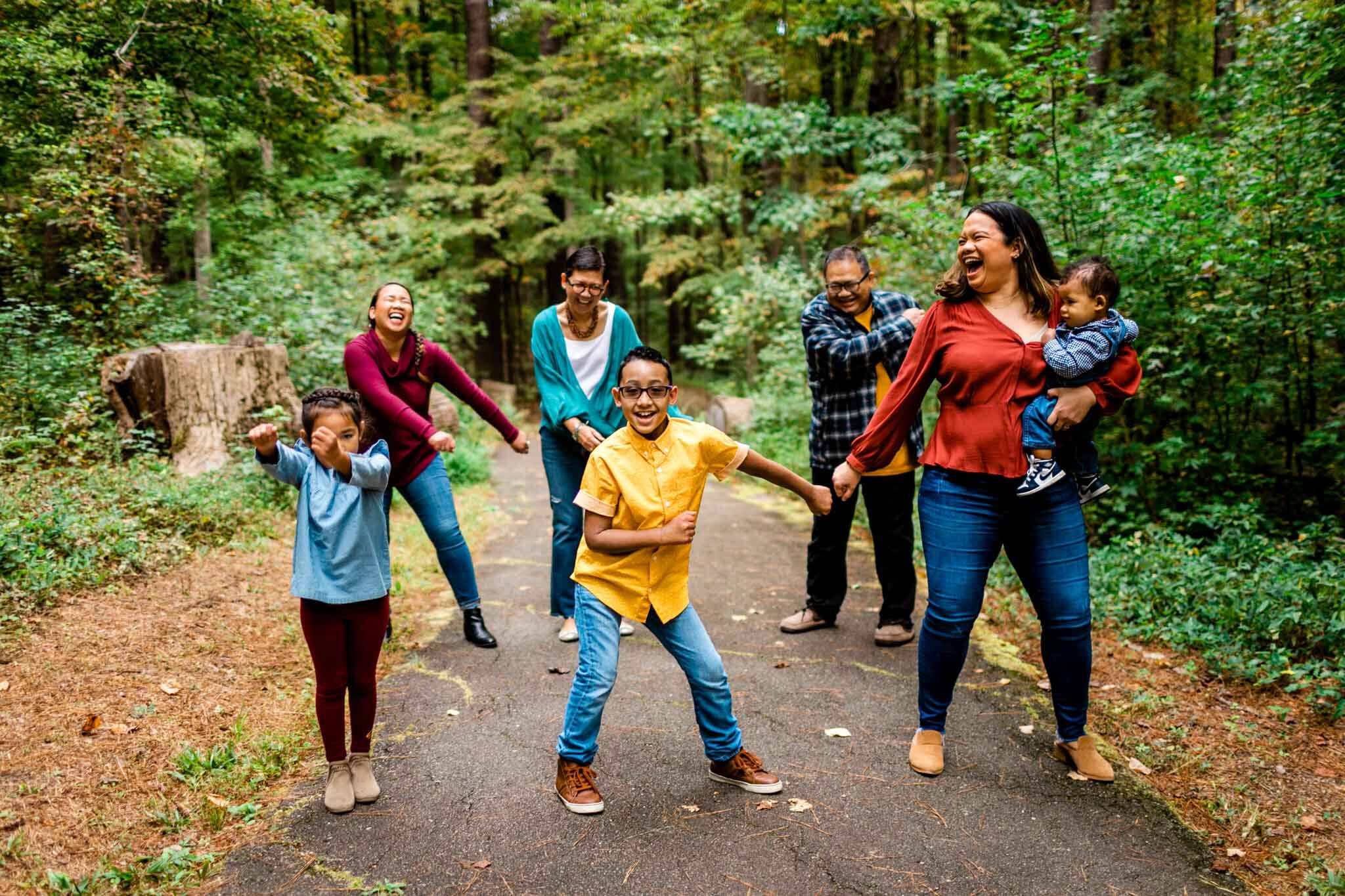 Raleigh Family Photographer | By G. Lin Photography | Umstead Park | Candid photo of family dancing