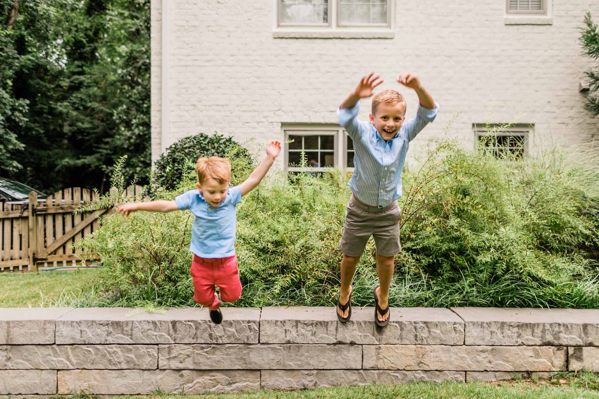 Raleigh Family Photographer | By G. Lin Photography | Boys jumping off of wall