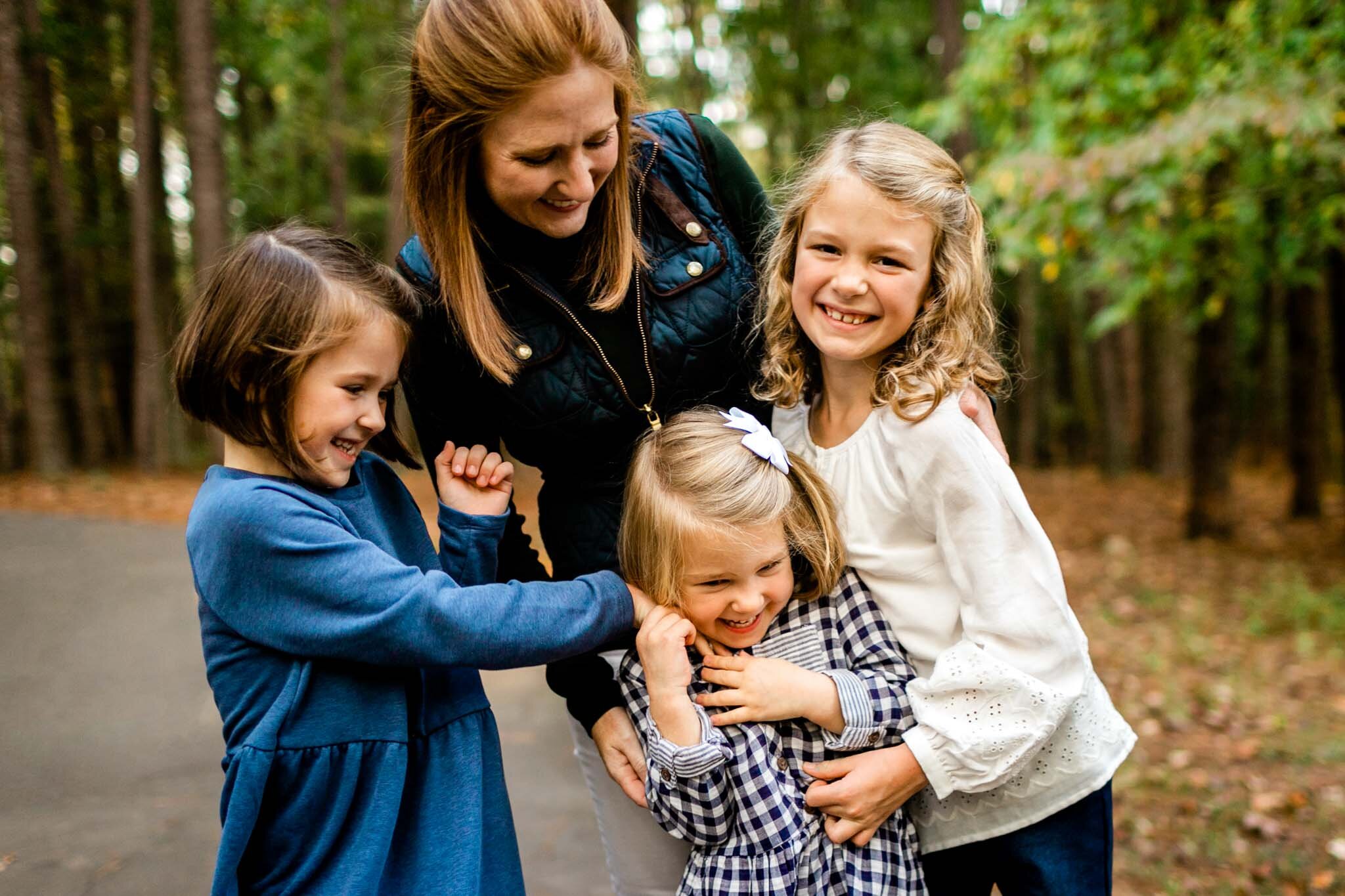 Raleigh Family Photographer | Umstead Park | By G. Lin Photography | Mother and daughters tickling each other