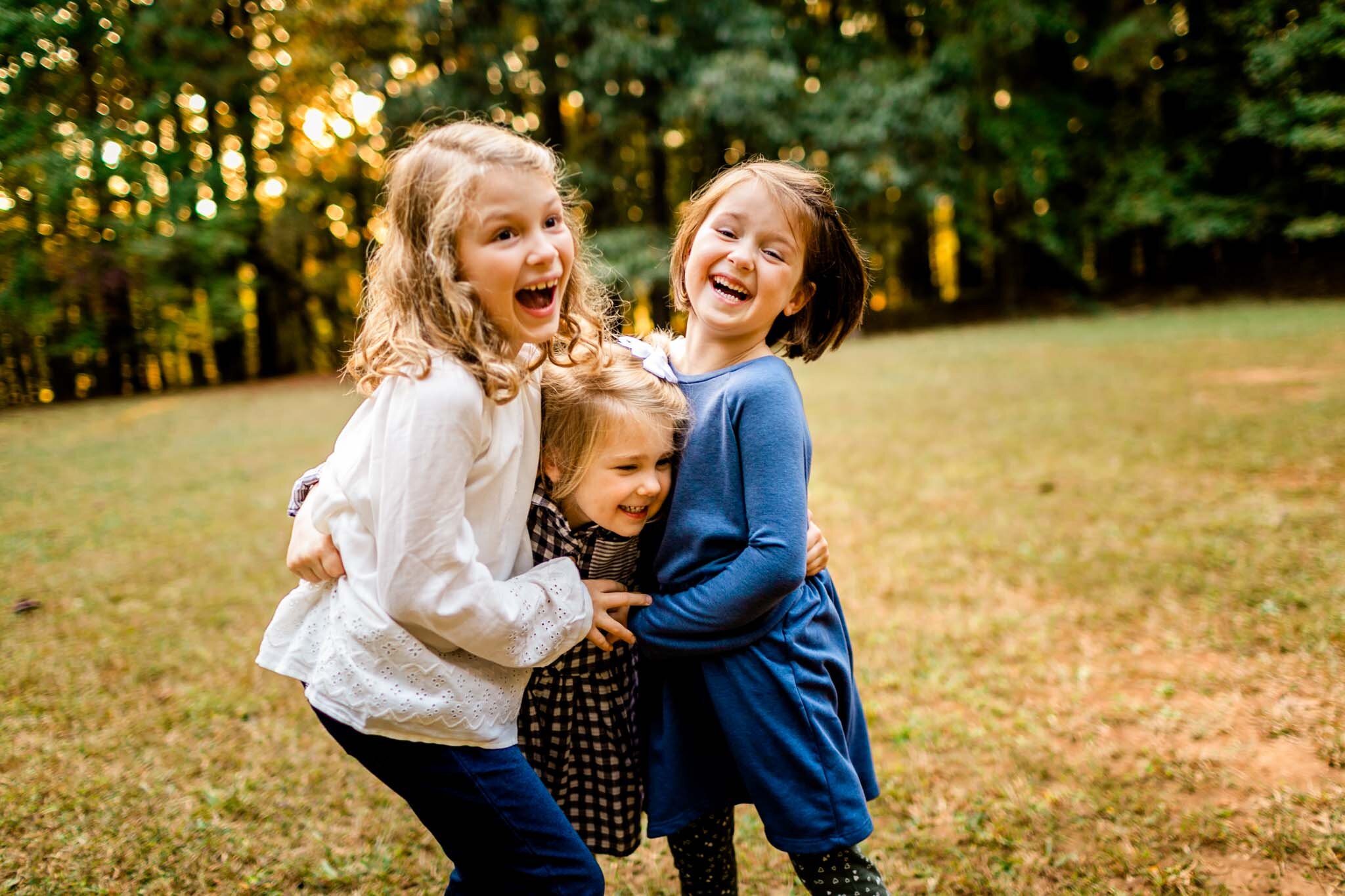 Raleigh Family Photographer | Umstead Park | By G. Lin Photography | Young girls laughing