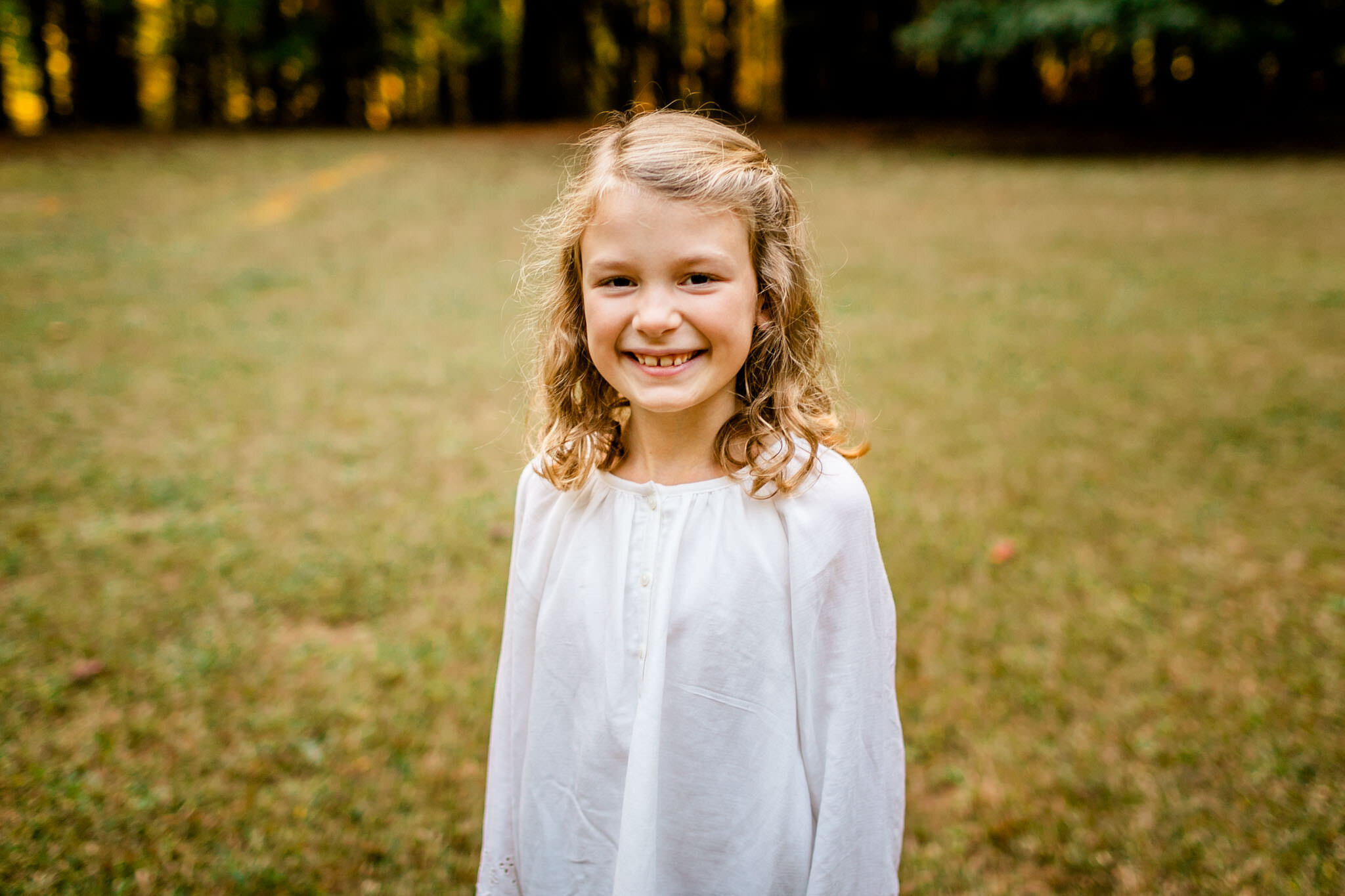 Raleigh Family Photographer | Umstead Park | By G. Lin Photography | Portrait of young girl smiling at camera