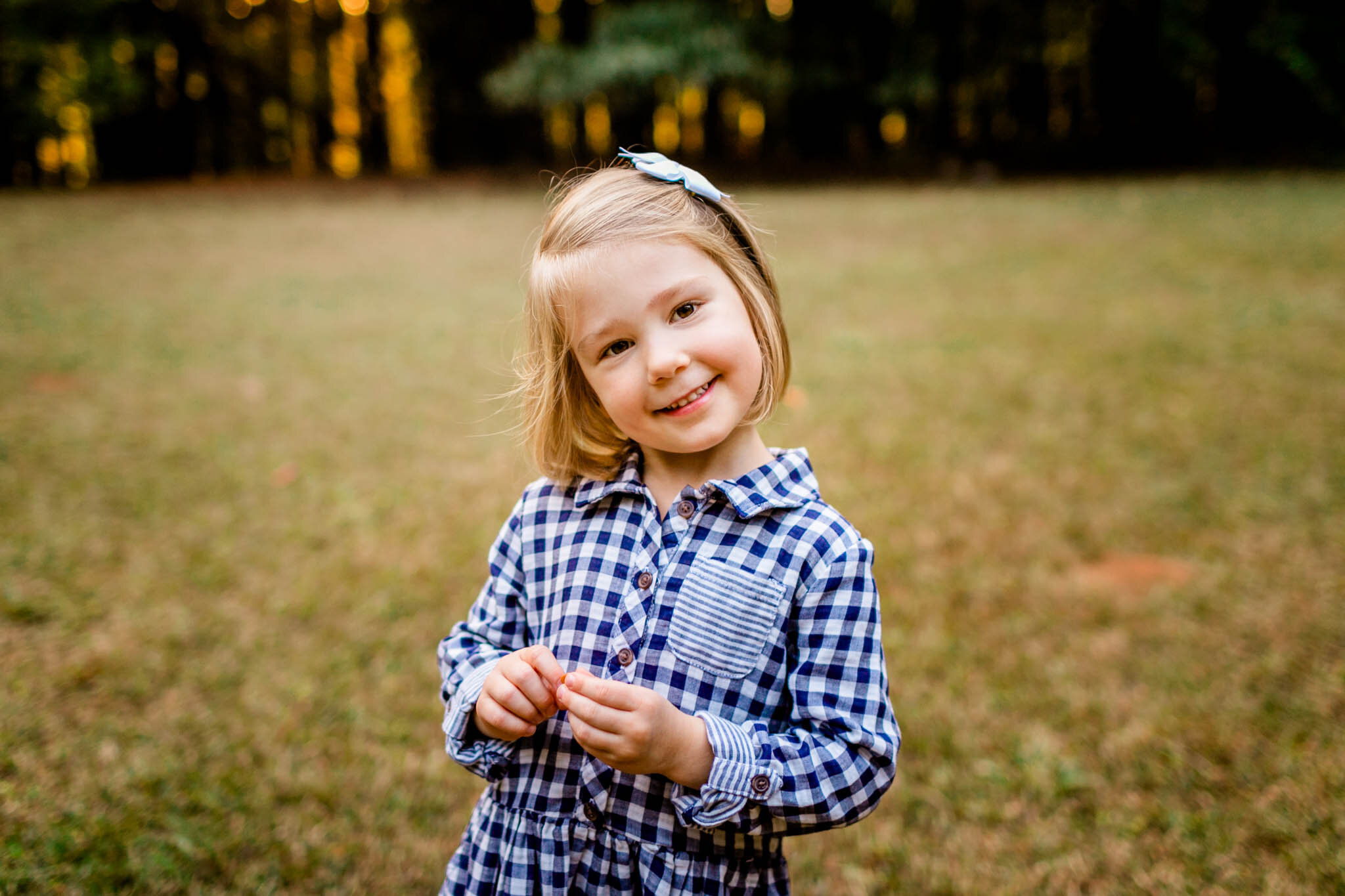 Raleigh Family Photographer | Umstead Park | By G. Lin Photography | Young girl smiling at camera