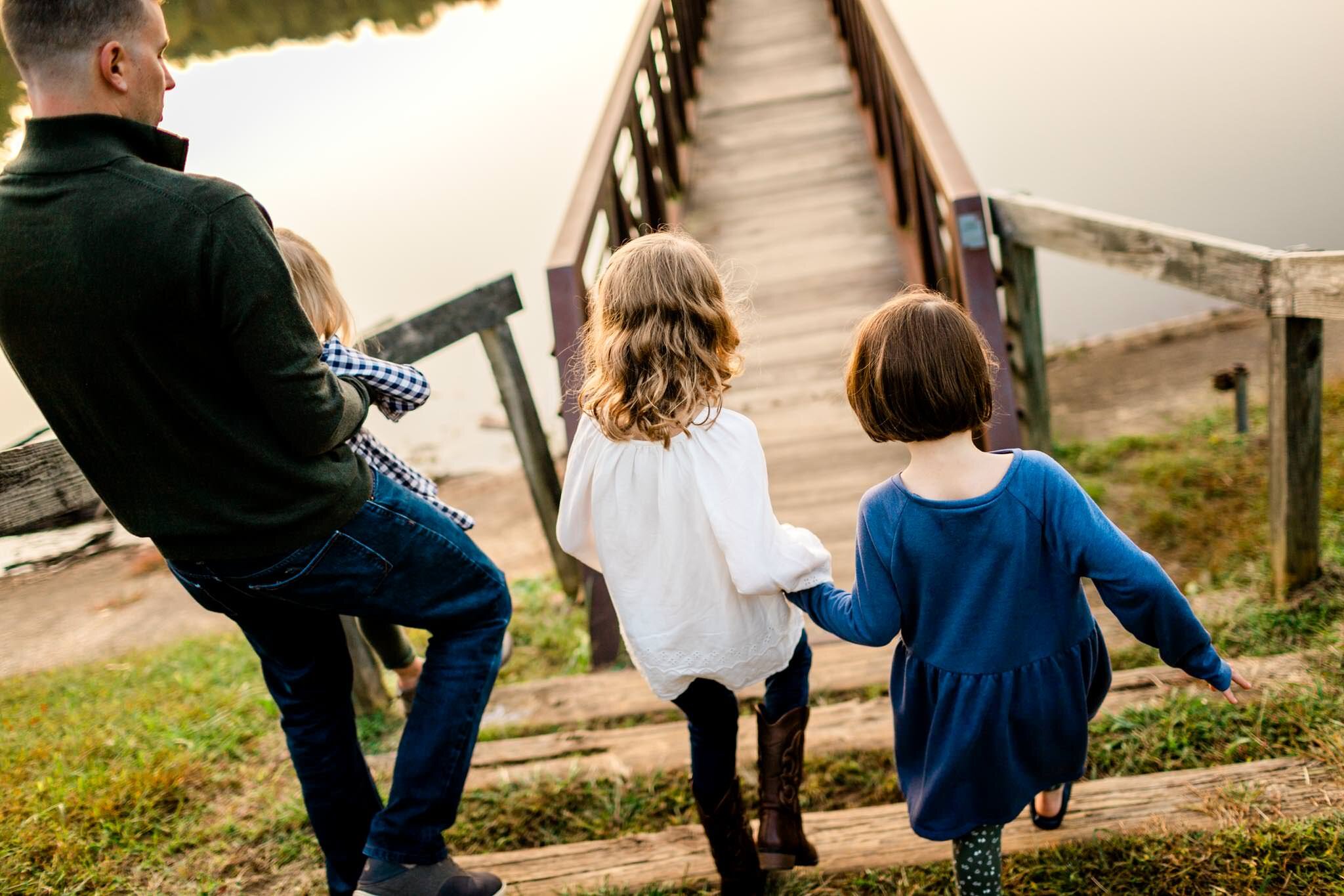 Raleigh Family Photographer | Umstead Park | By G. Lin Photography | Man with two daughters walking down steps