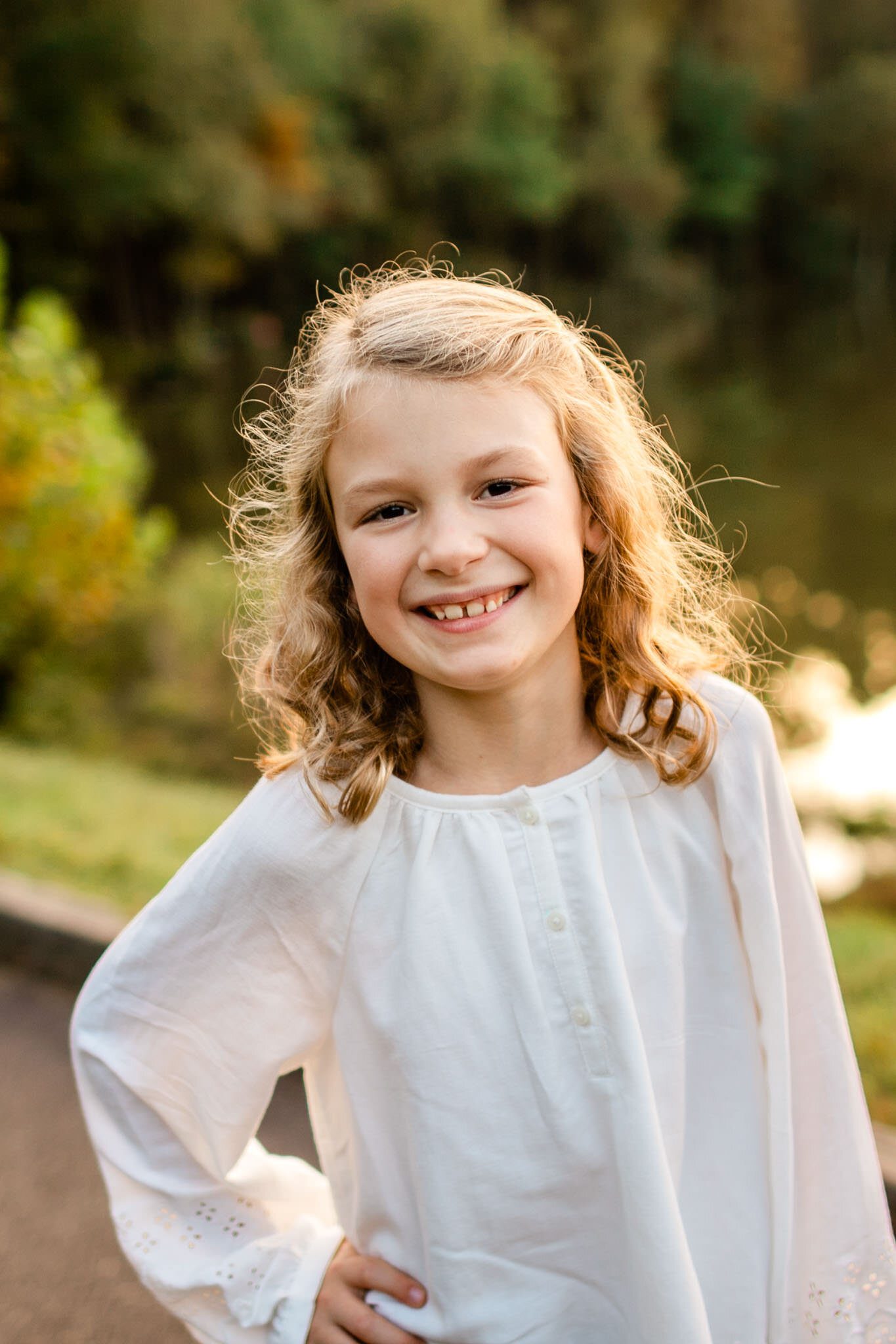 Raleigh Family Photographer | Umstead Park | By G. Lin Photography | Beautiful sunset portrait of young girl smiling