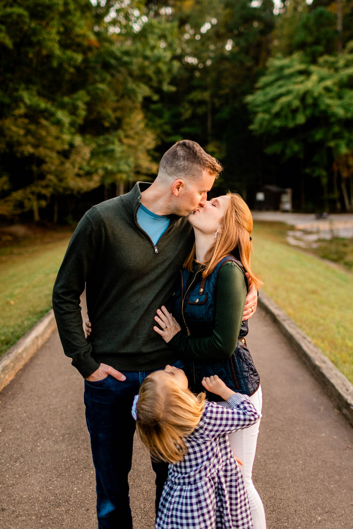 Raleigh Family Photographer | Umstead Park | By G. Lin Photography | Husband and wife kissing