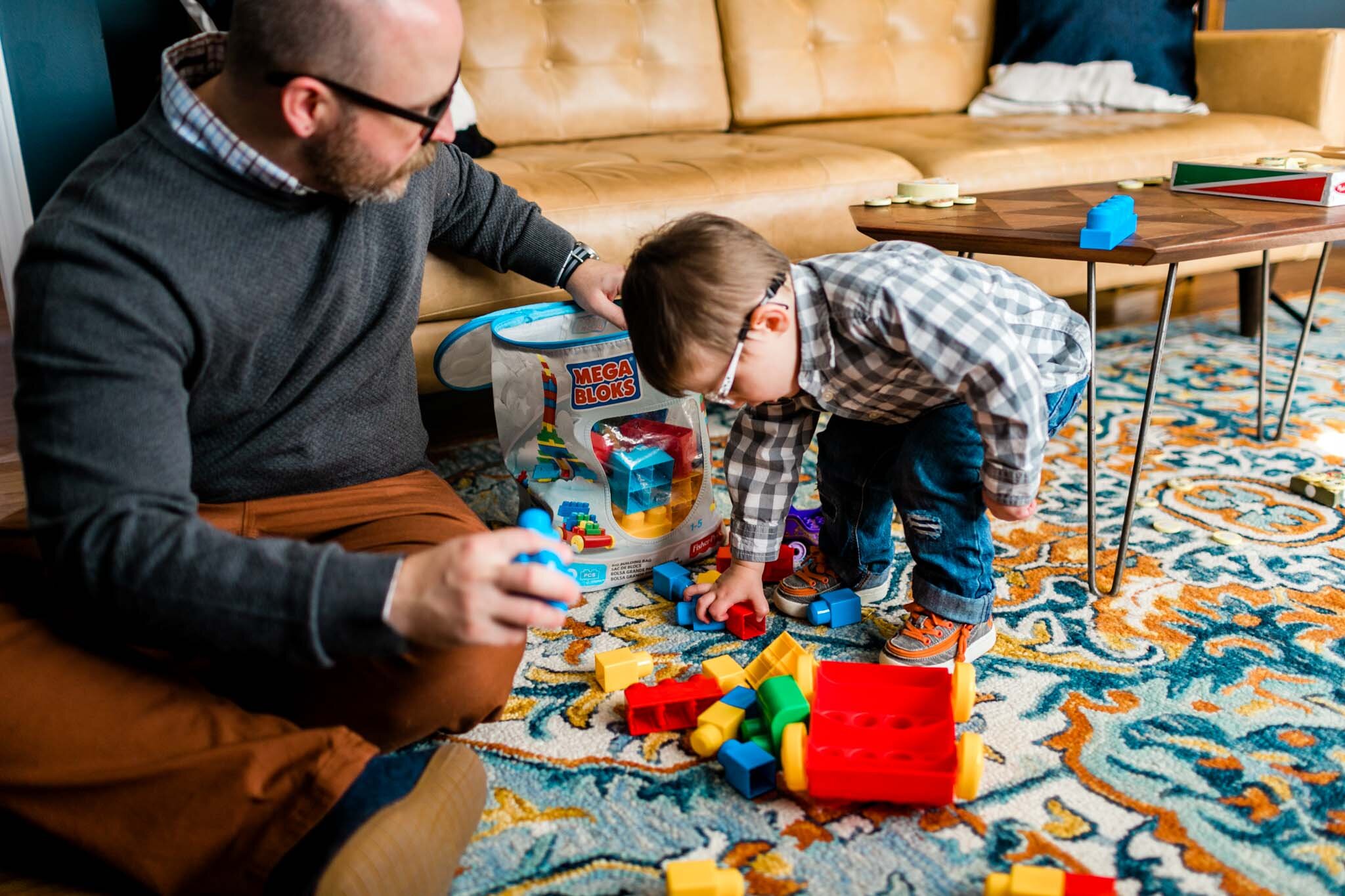 Raleigh Lifestyle Family Photographer | By G. Lin Photography | Father helping son with toys