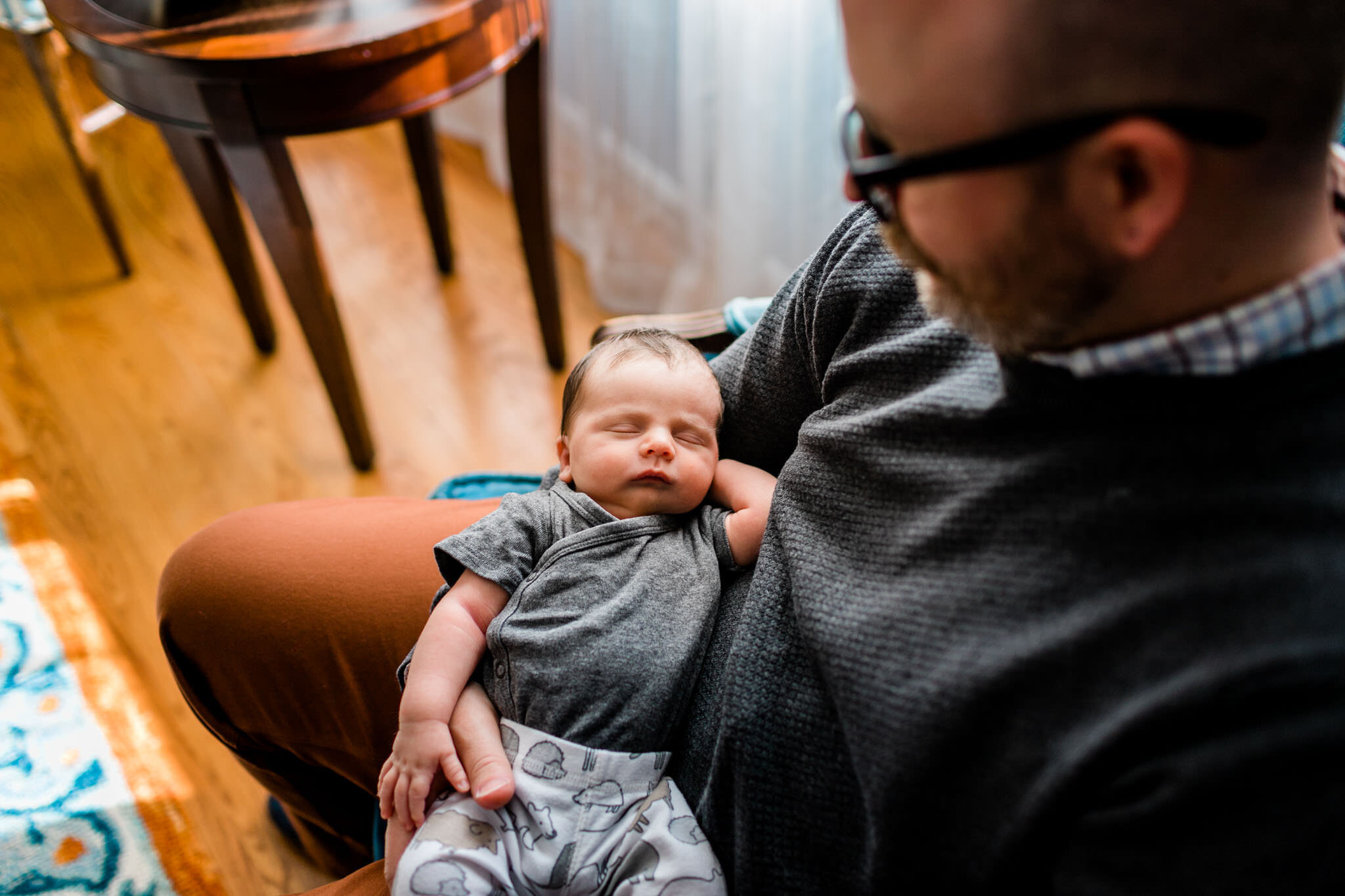 Raleigh Newborn Photographer | By G. Lin Photography | Baby sleeping on dad's lap