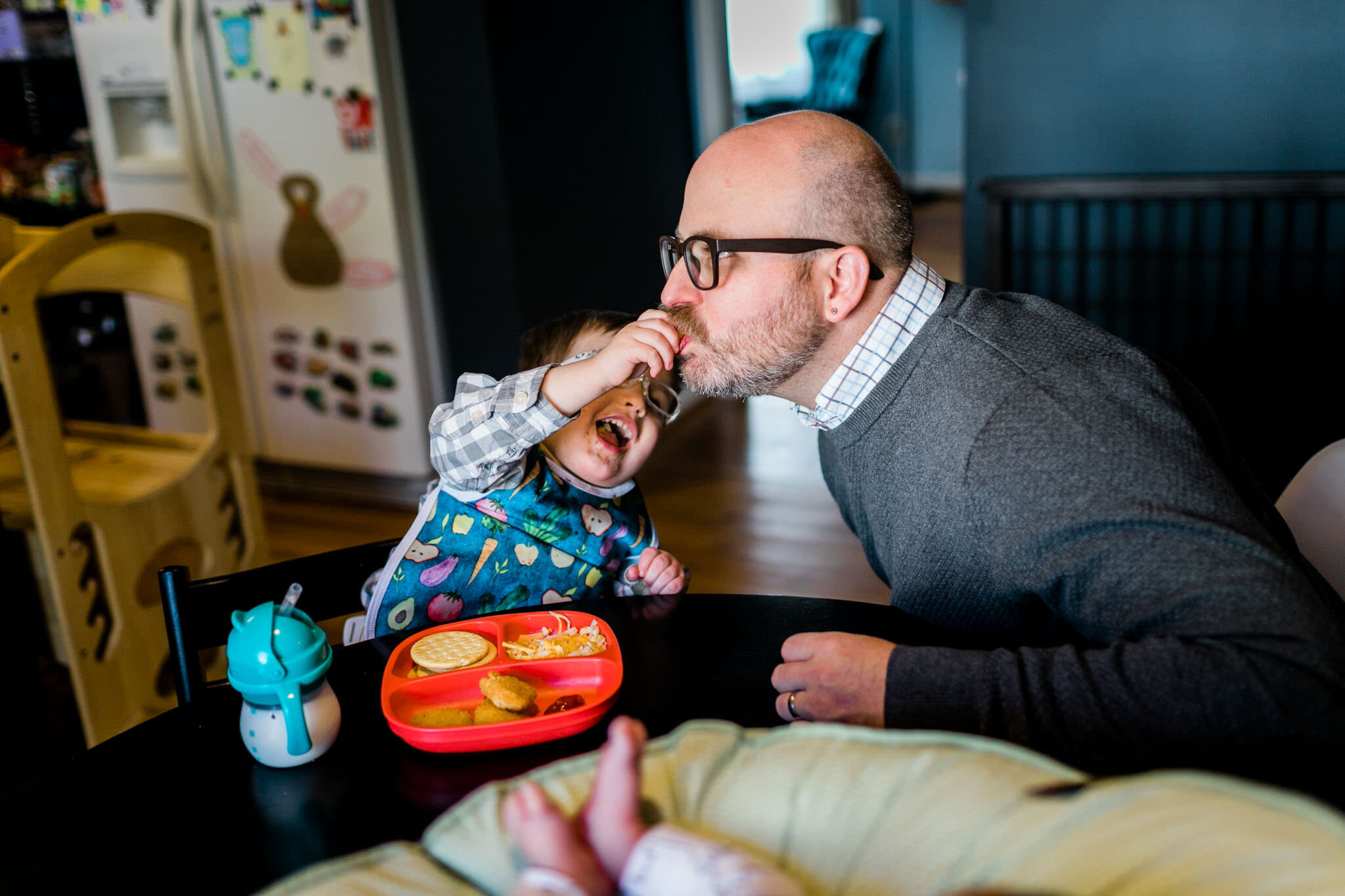 Raleigh Lifestyle Family Photographer | By G. Lin Photography | Toddler boy feeding dad chicken nugget