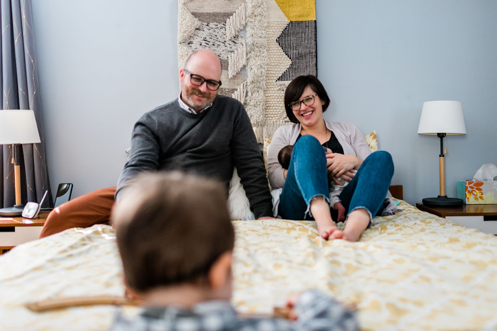 Raleigh Lifestyle Family Photographer | By G. Lin Photography | Parents smiling at son in bedroom