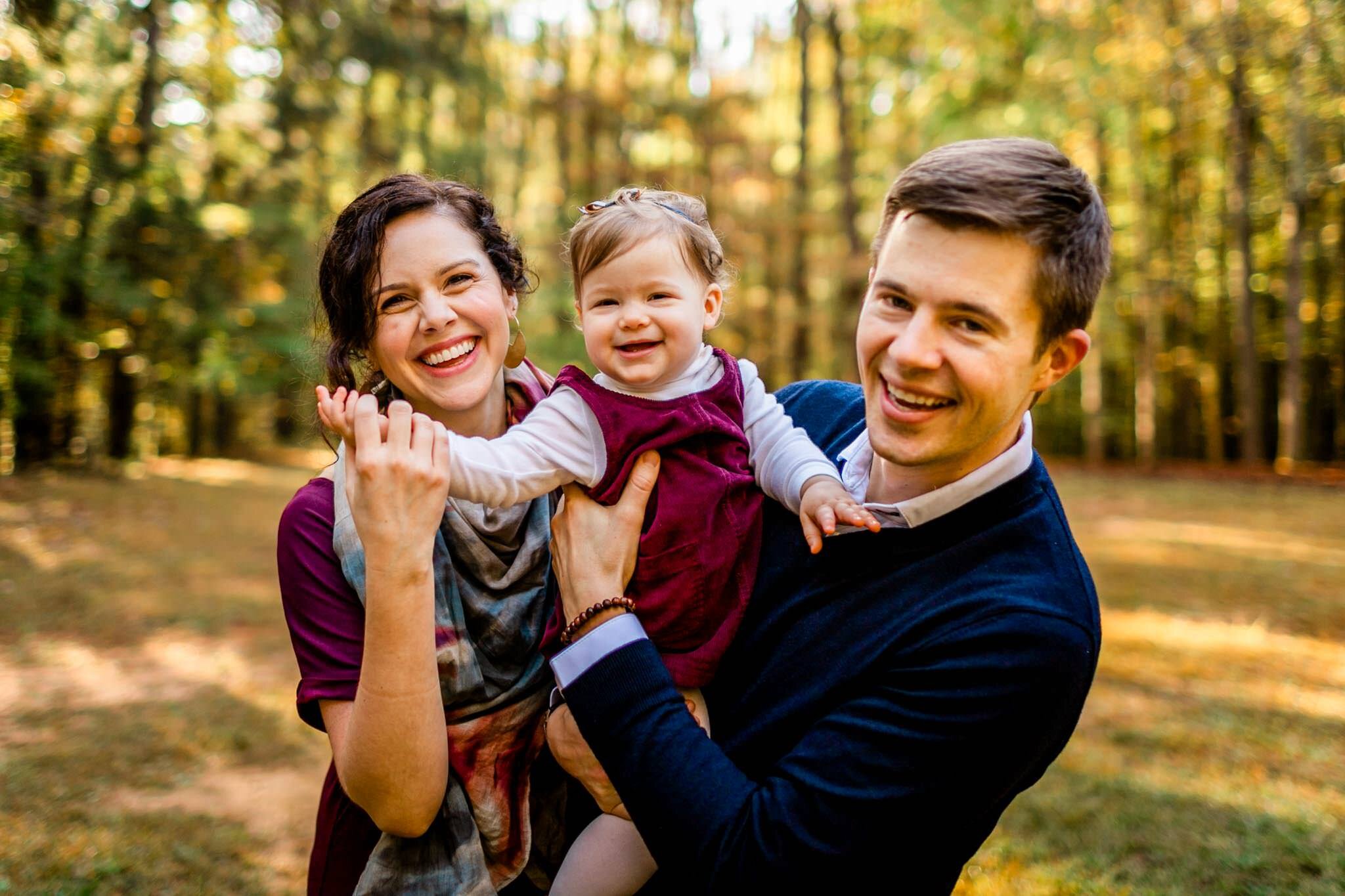 Raleigh Family Photographer | By G. Lin Photography | Umstead Park | Parents holding baby girl